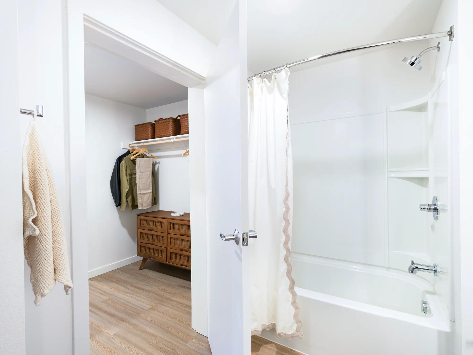 Dual entrance bathroom with pass-through closet