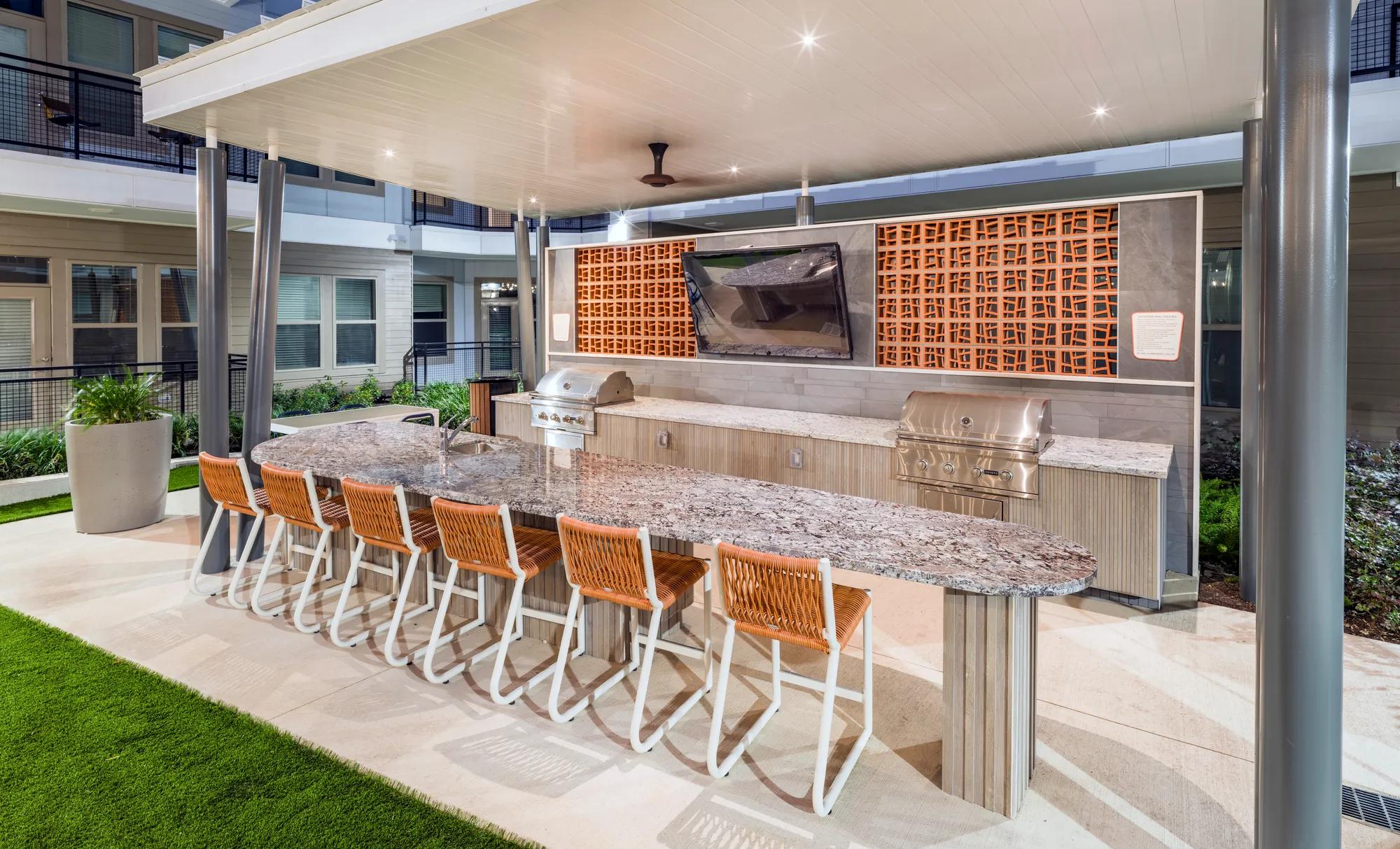 outdoor grilling station near pool modera garden oaks apartments houston tx