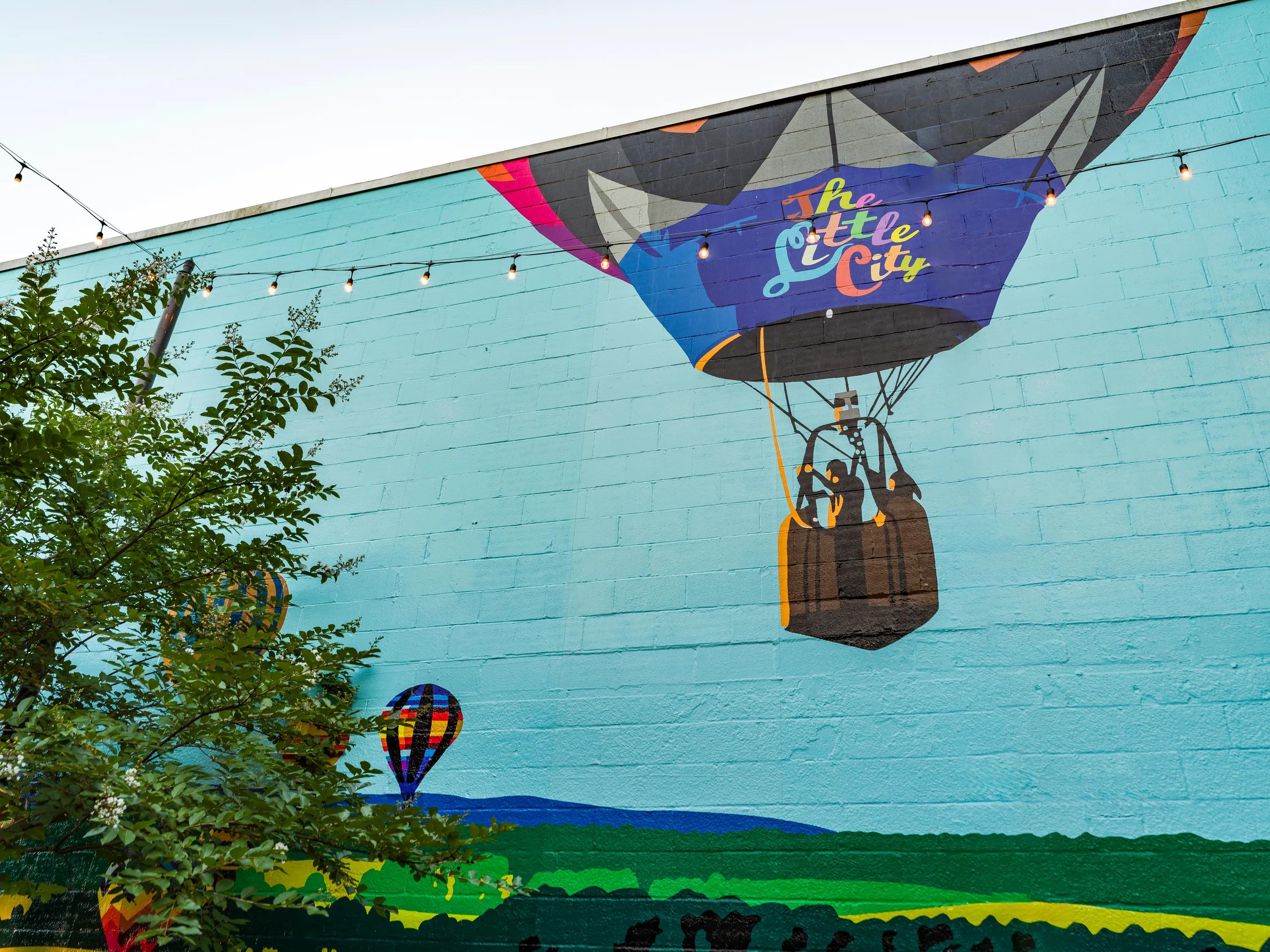 outdoor wall art of hot air balloon for The Little City at modera falls church apartment homes for rent in va
