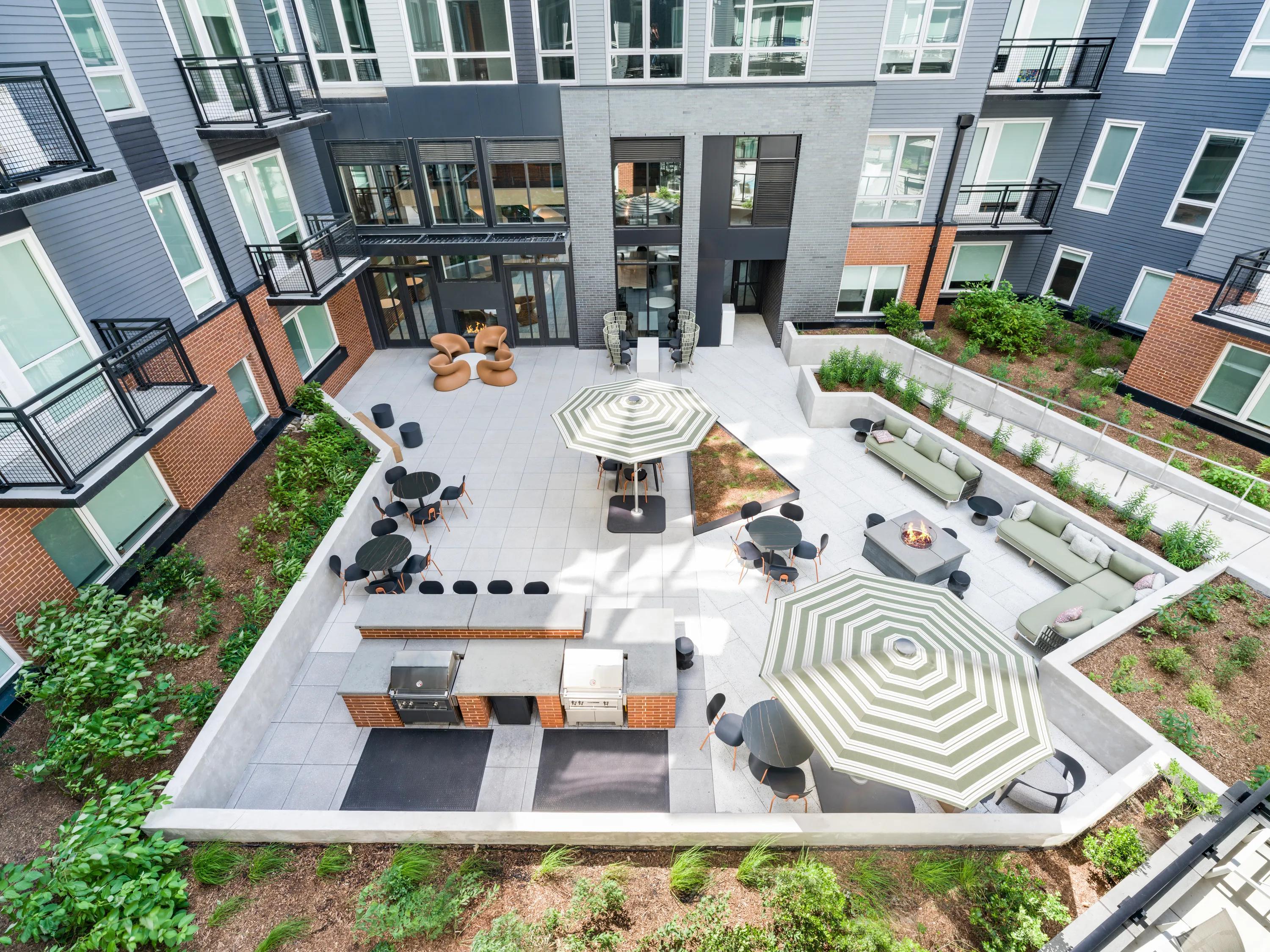 interior courtyard with grilling area modera h street apartment homes for rent in washington dc