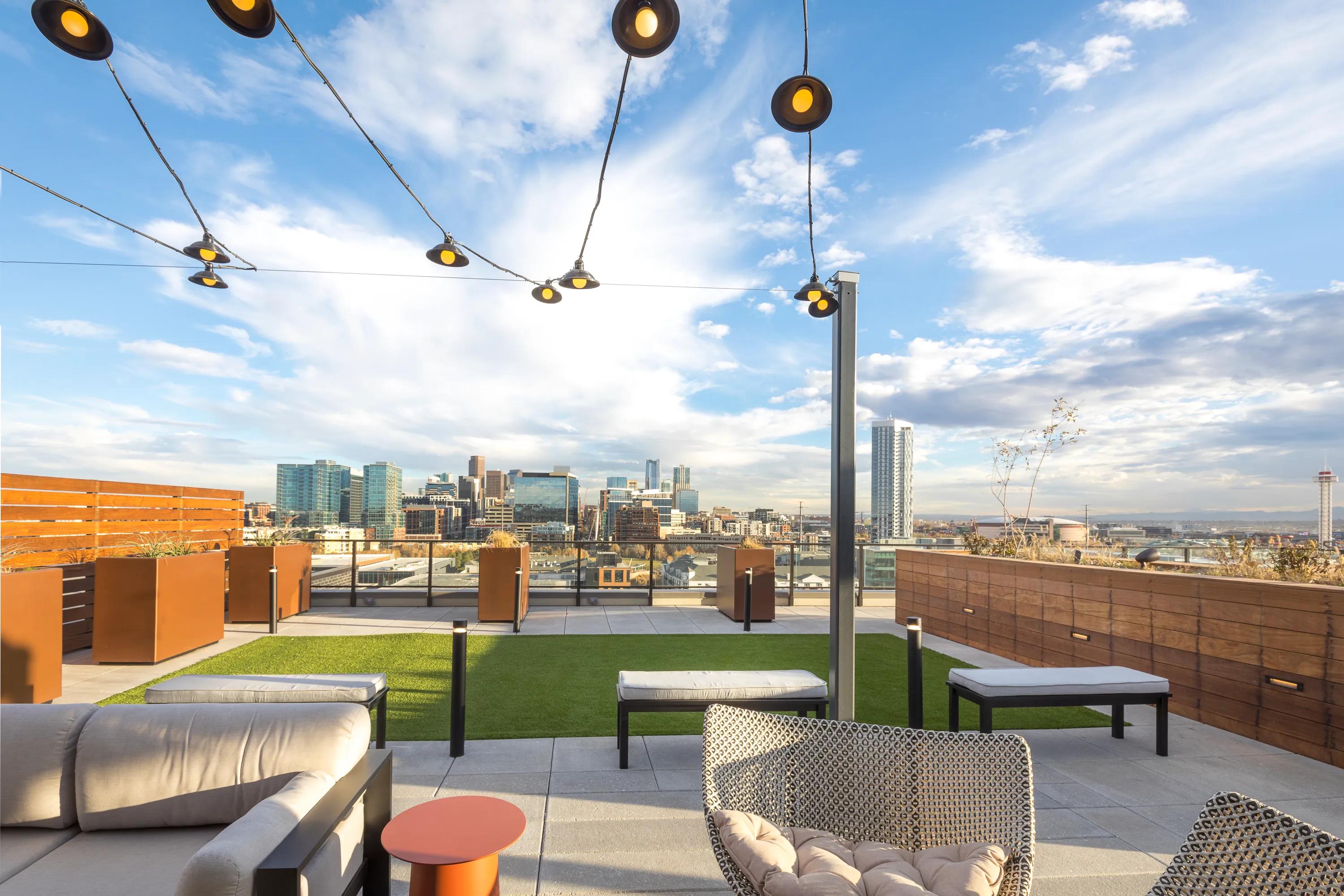 Rooftop Deck Lounge Area with Panoramic Views of the City modera lohi apartments in denver co