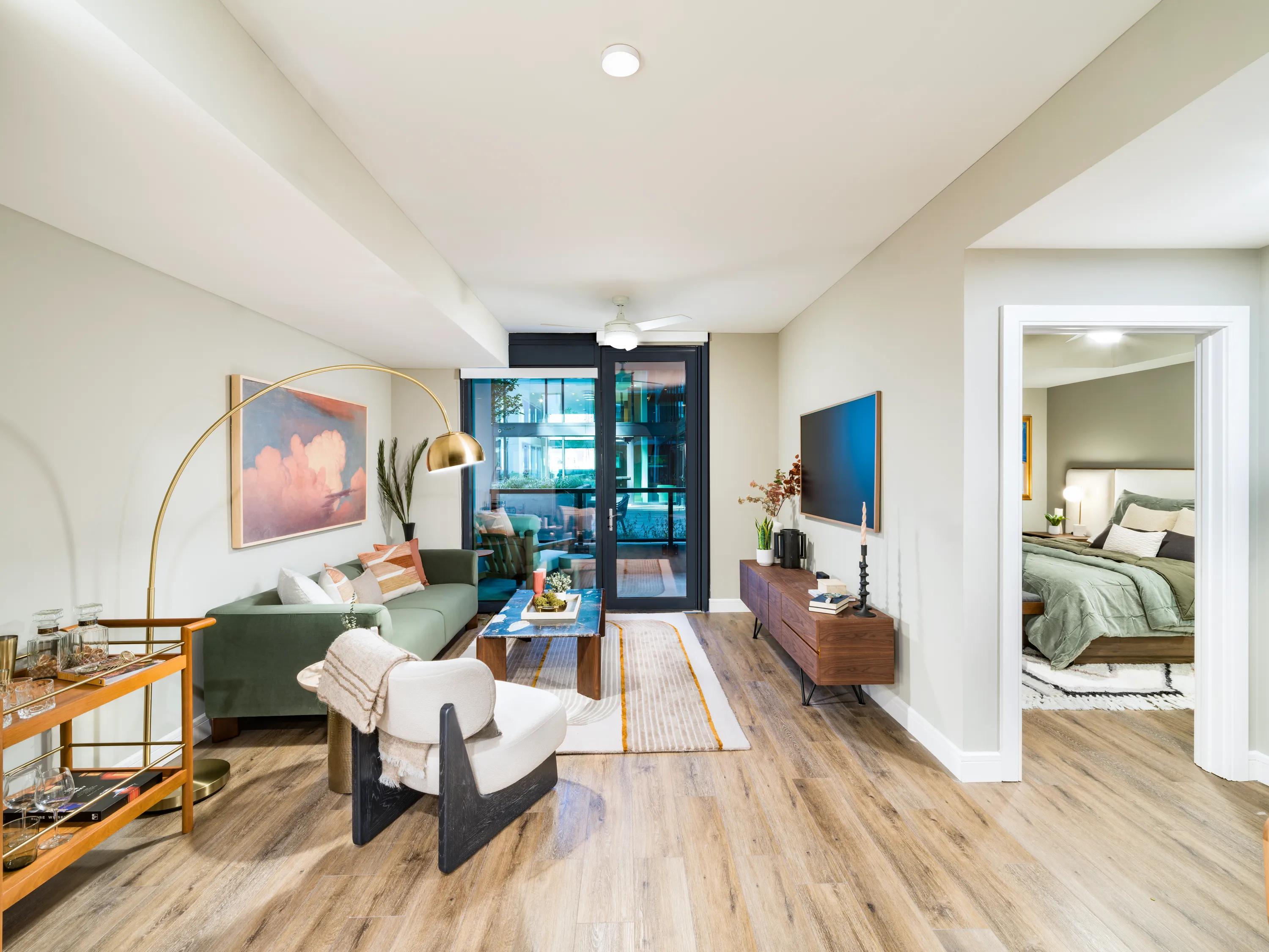 modern living area with hardwood style flooring modera mcgavock apartments for rent in nashville tn