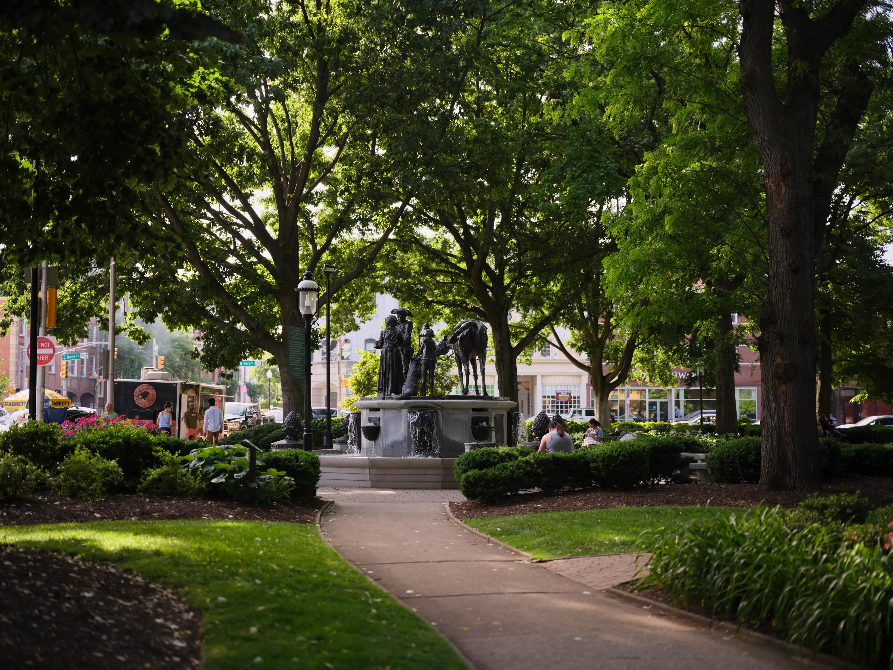 park with statue on corner and large trees metropolitan at 40 park apartment homes for rent in morristown nj