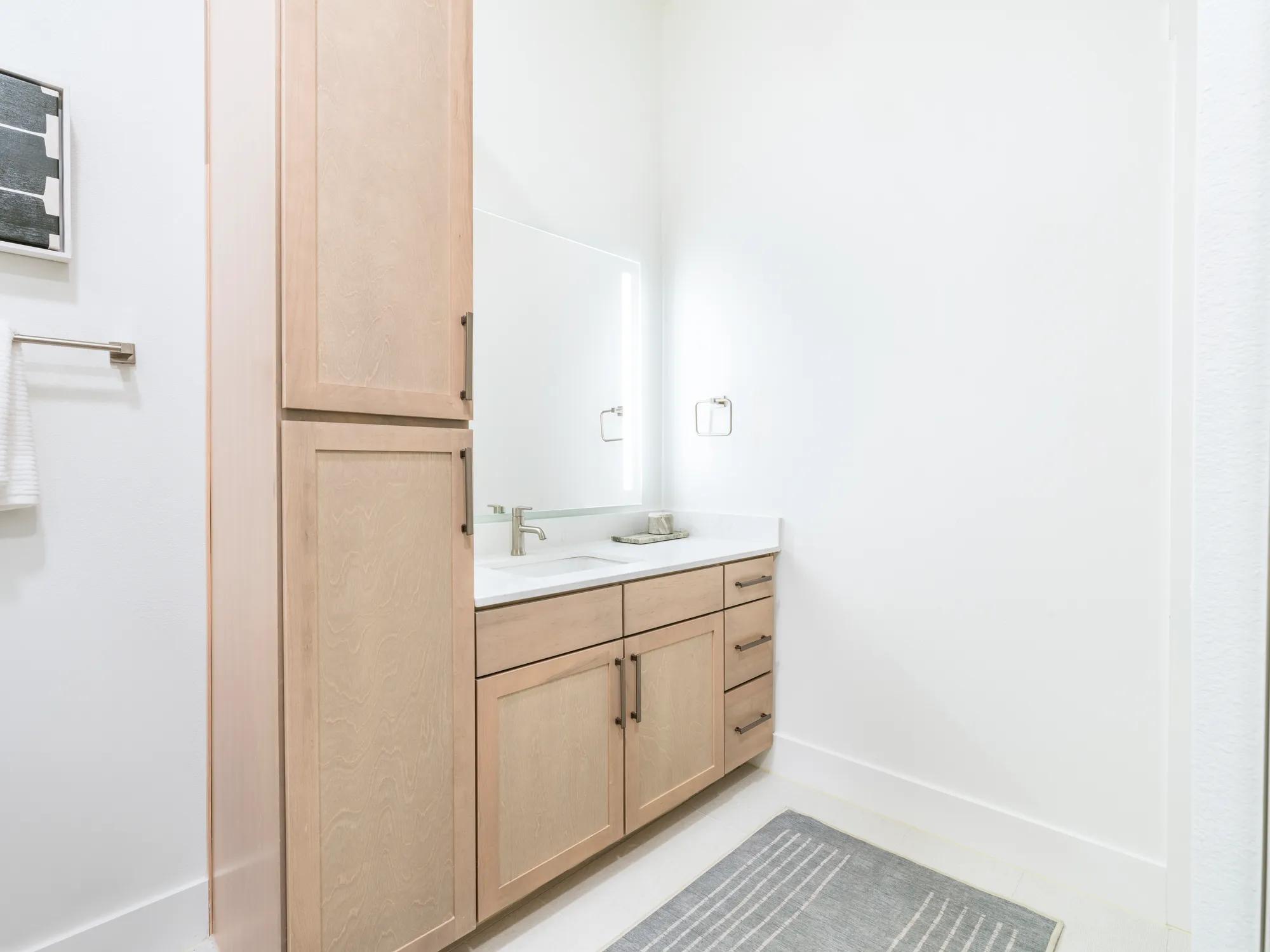 light wood cabinetry in bathroom modera trailhead apartment homes for rent in dallas texas