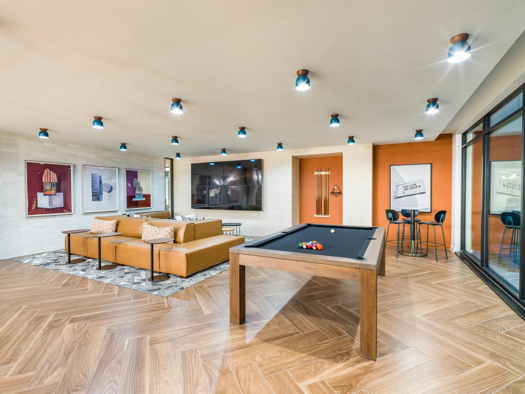 clubroom with comfortable couch and coworking spaces