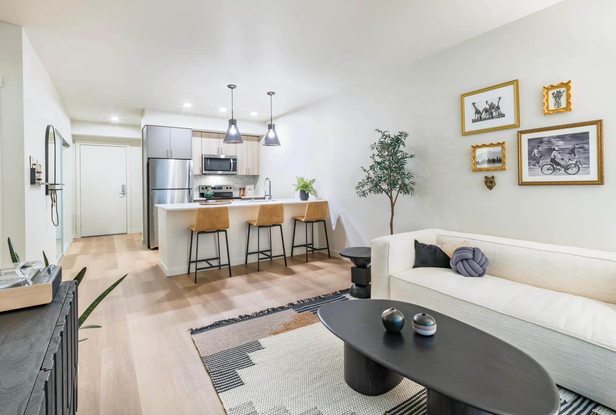 modern kitchen with island seating and pendant lighting modera northgate apartment homes for rent in seattle wa