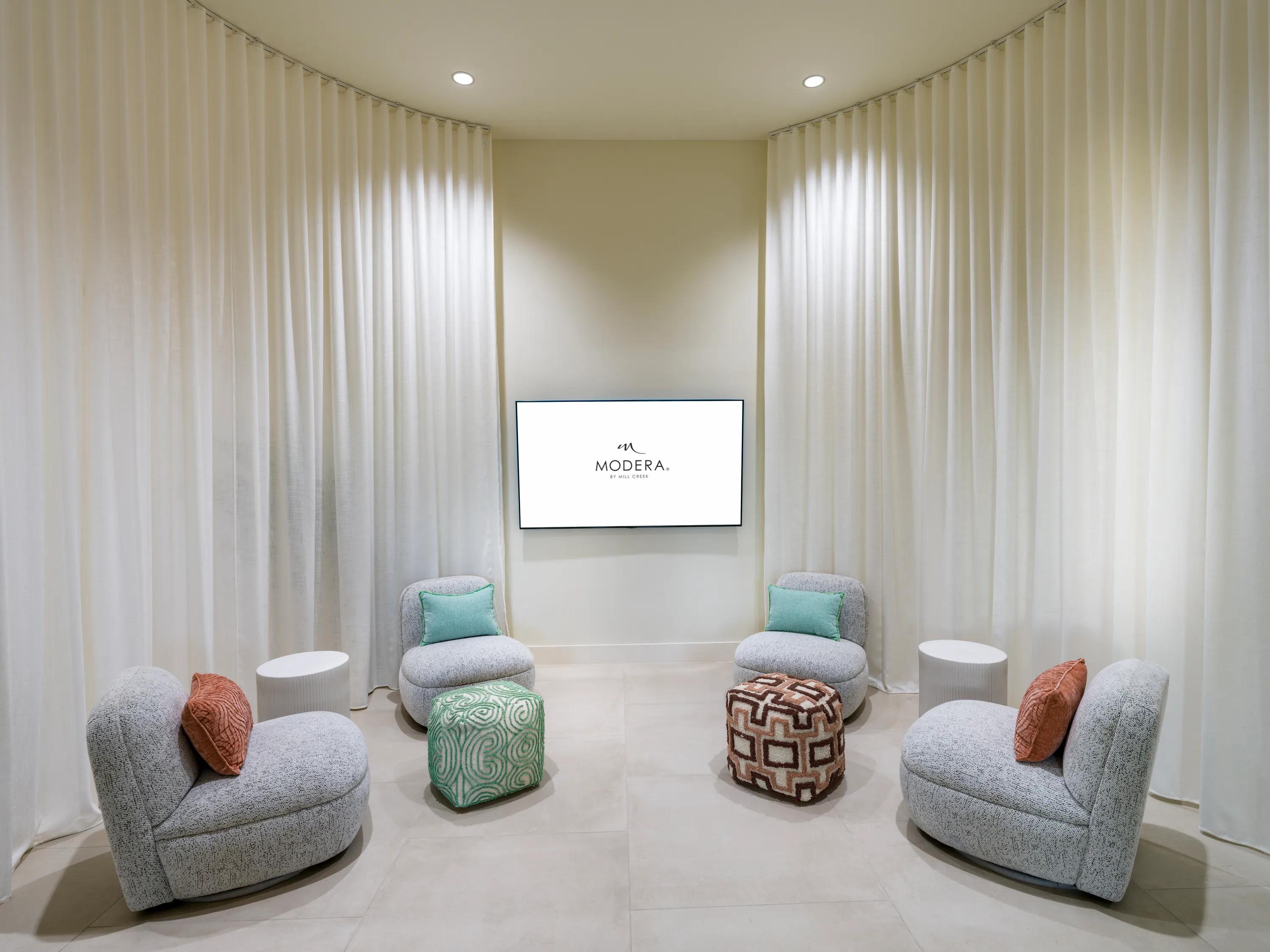 common seating area with tv on wall modera academical village apartment homes for rent in davie fl