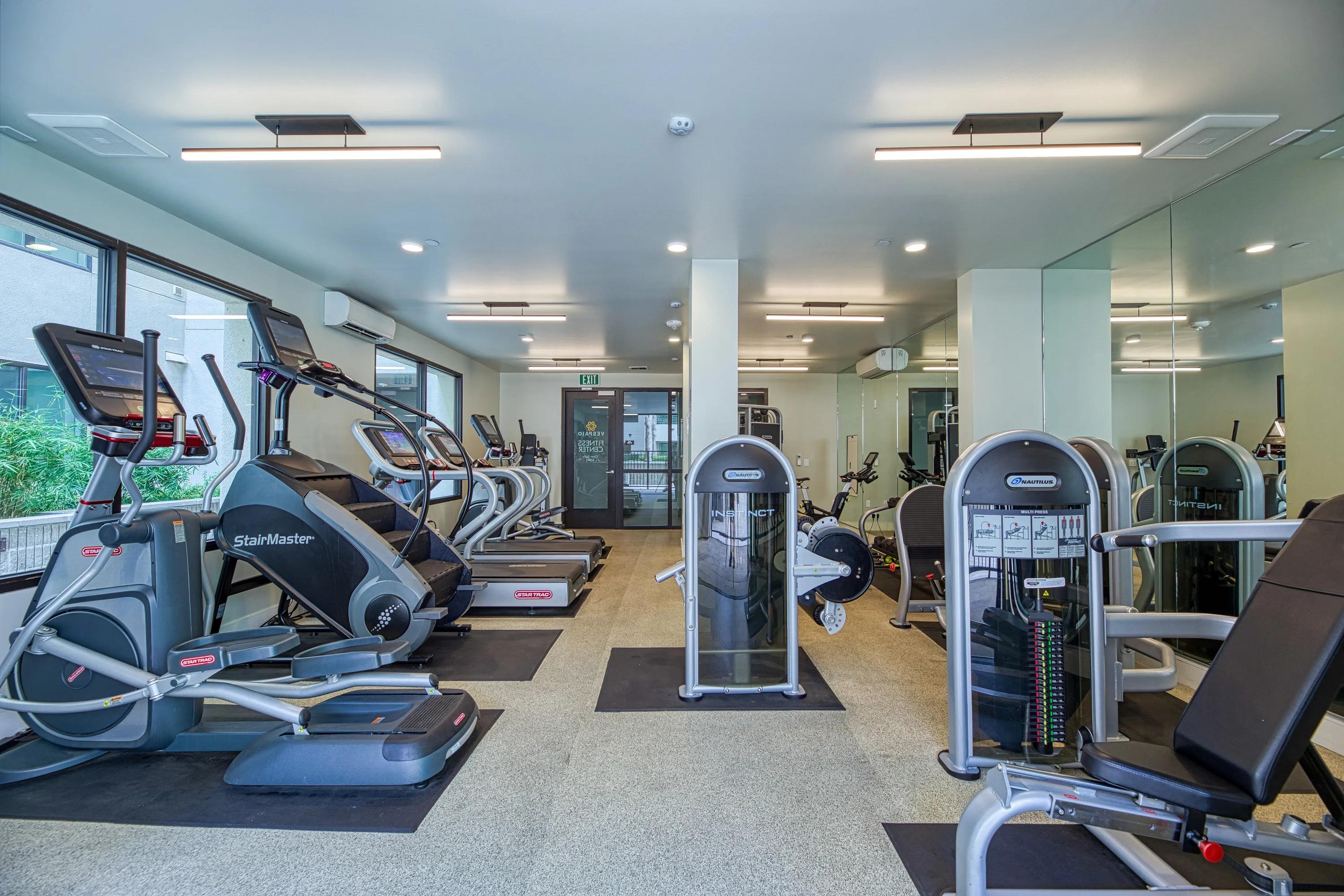 Fitness center with cardio and weight machines, with direct access to pool deck vespaio apartments