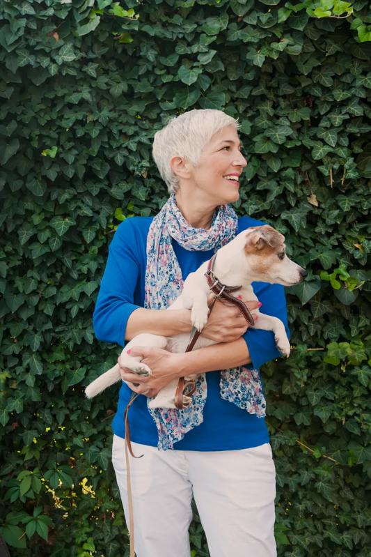 Woman with dog at modera georgetown apartment homes for rent georgetown tx