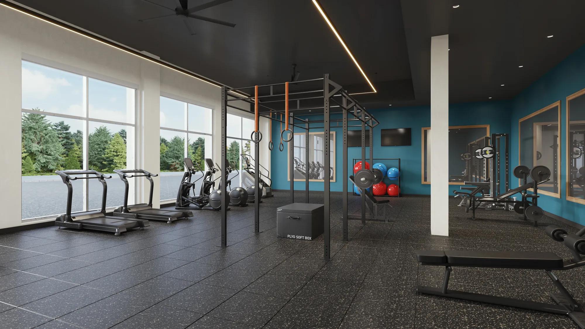 fitness center with aerobic equipment and large windows at modera shoreline apartment homes for rent in wa