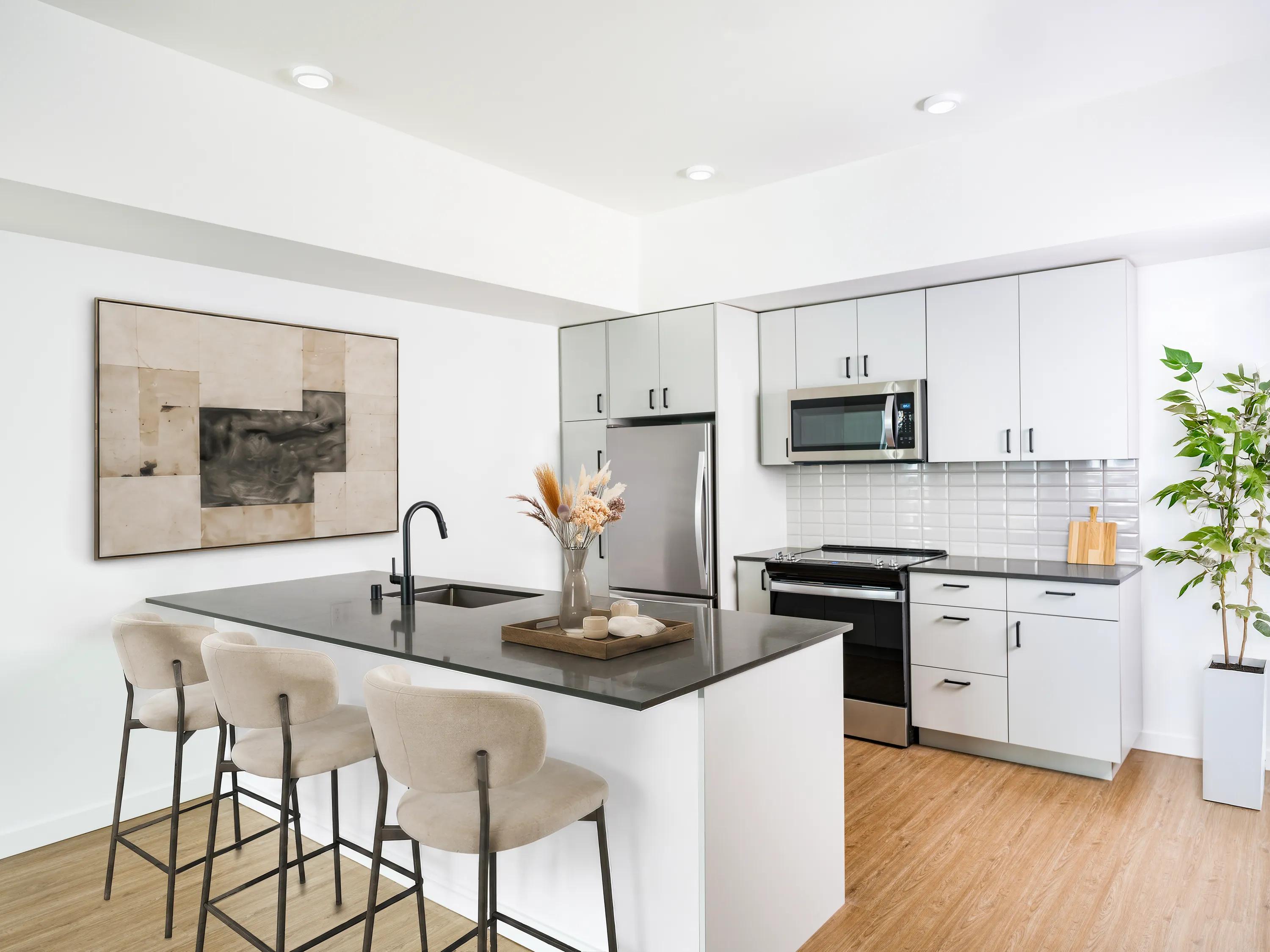 kitchen with island virtually staged modera bridle trails apartment homes for rent