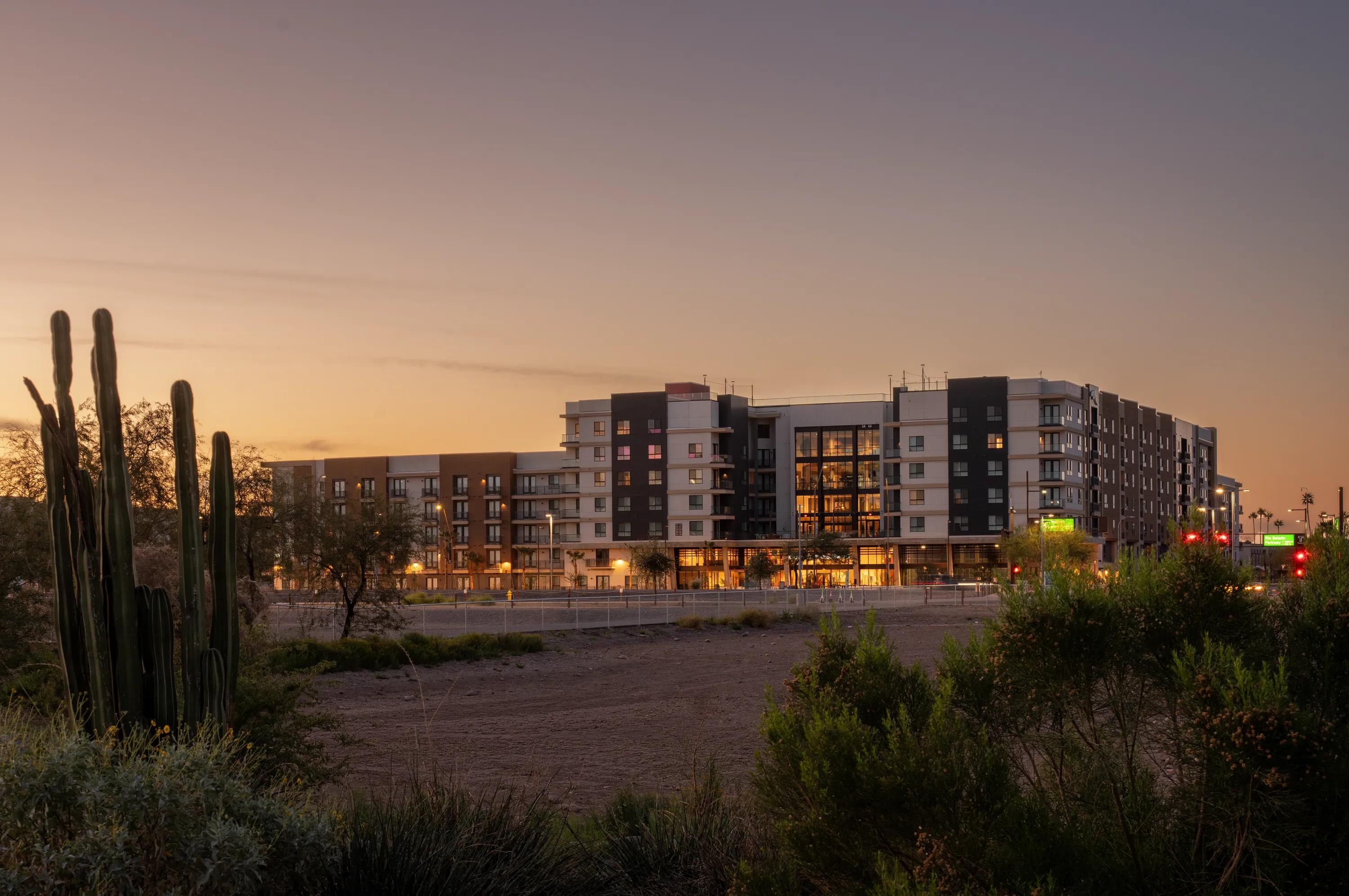 ground level sunset image from afar modera rio salado apartments for rent in tempe az