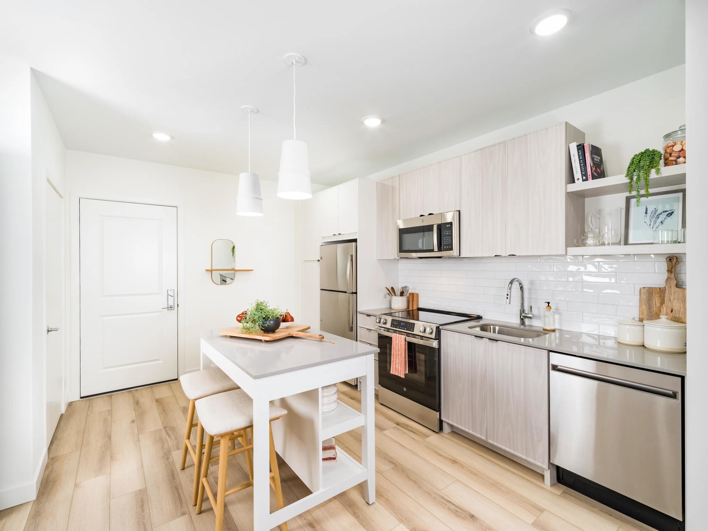 kitchen island with stainless steel appliances modera revere beach apartment homes for rent in revere ma