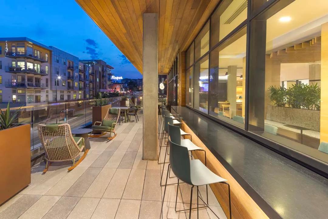 Work from home or enjoy your morning cup o' joe at the Modera LoHi indoor-outdoor lounge modera lohi apartments in denver co