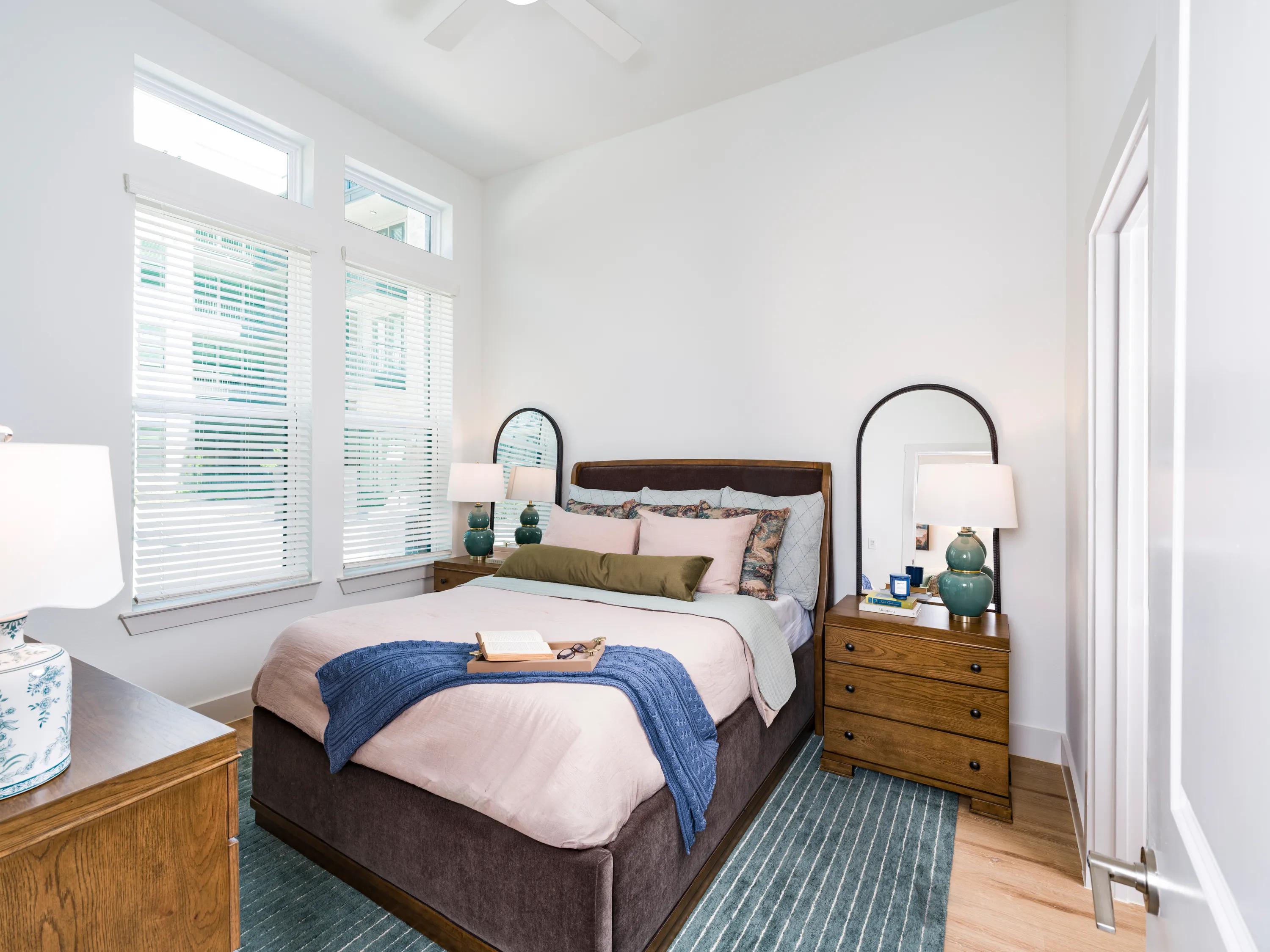 primary bedroom with tall windows modera walsh heights apartments aledo tx