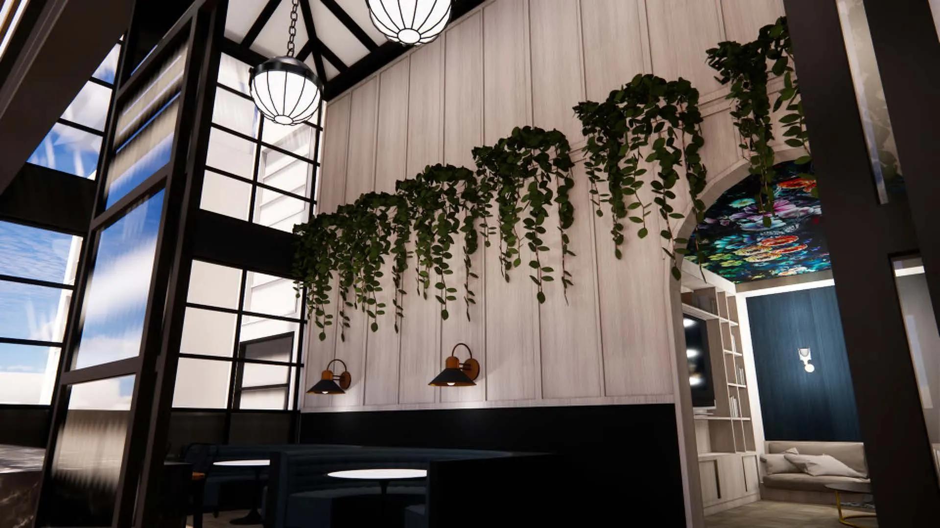 vines and plants hanging on two story amenity space with table seating at modera university park apartment homes for rent in denver co