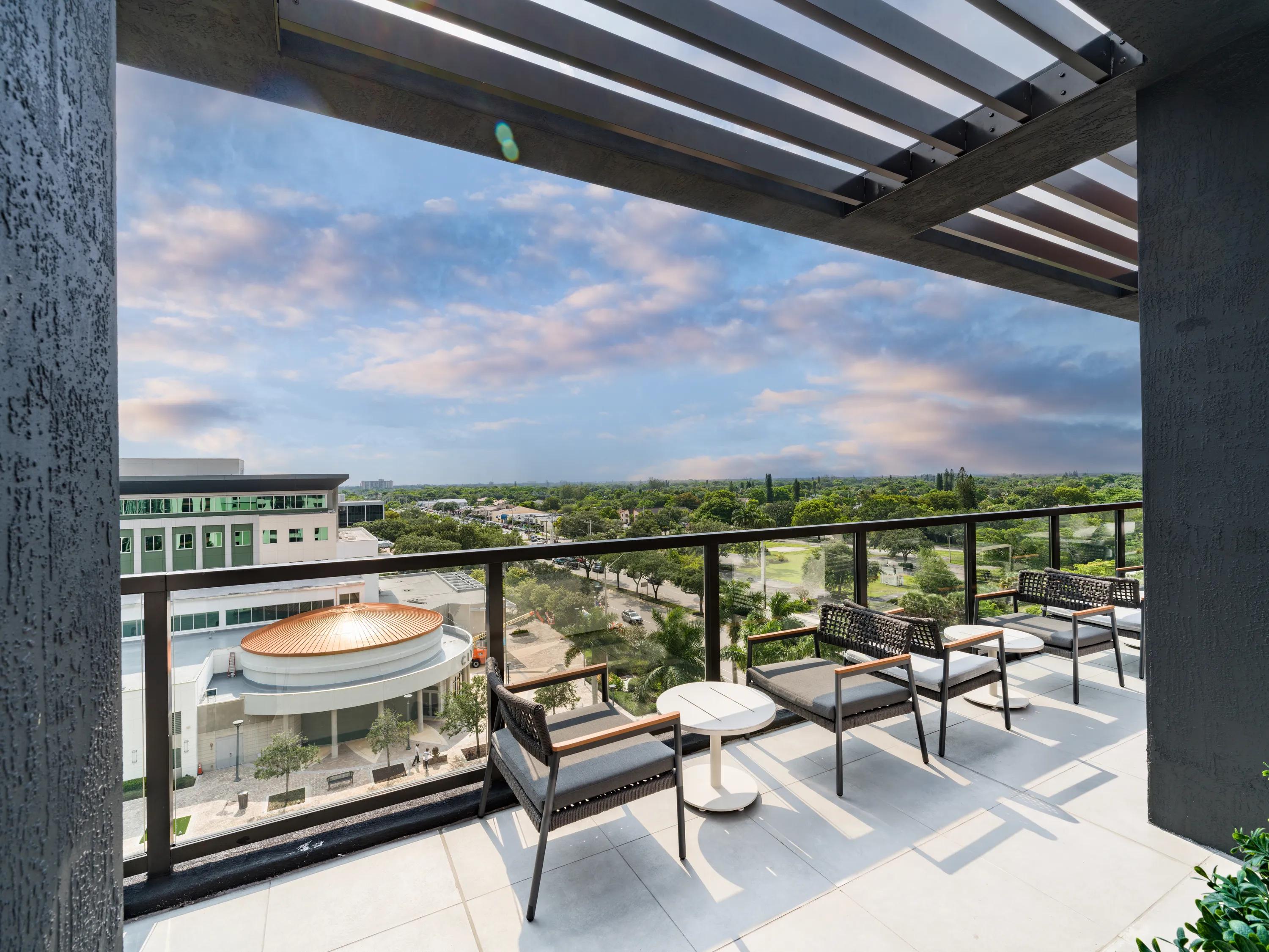Covered rooftop overlook with lounge seating modera coral springs phase 2 apartments in coral springs fl