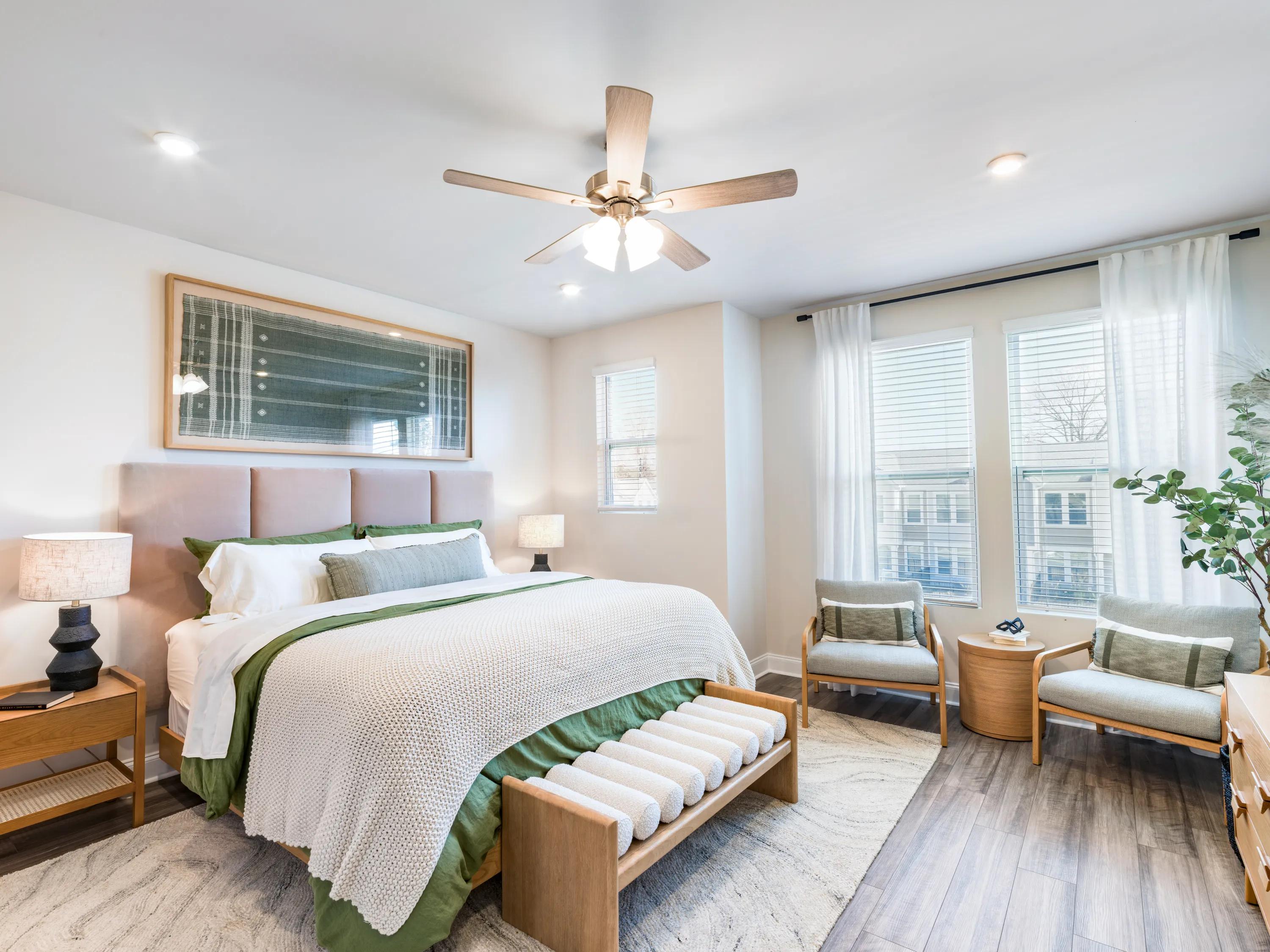 bedroom  with window and ceiling fan with amavi mooresville single family homes for rent in nc