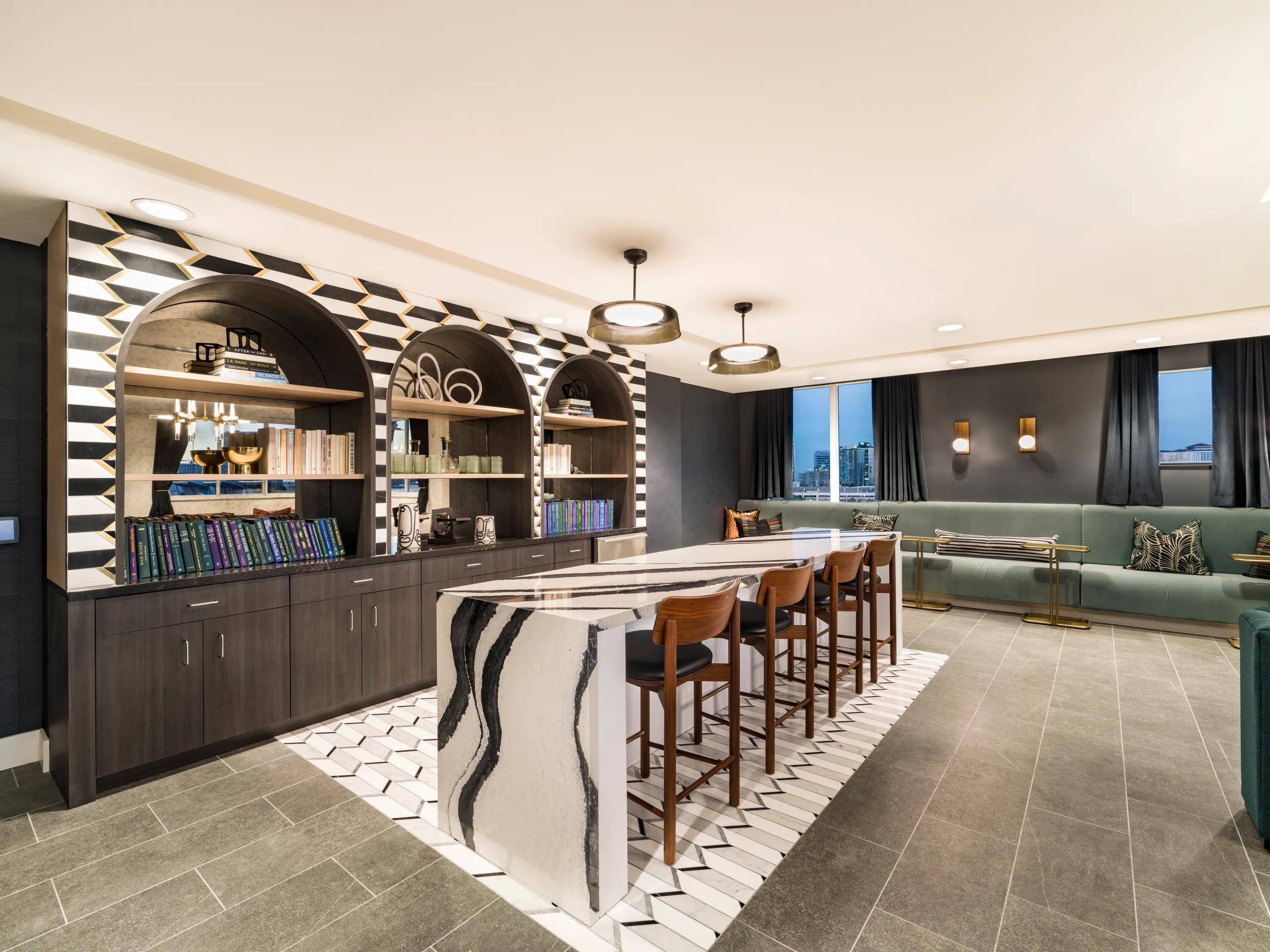 sky lounge with demonstration kitchen and fireplace modera encore apartment homes for rent in tampa fl