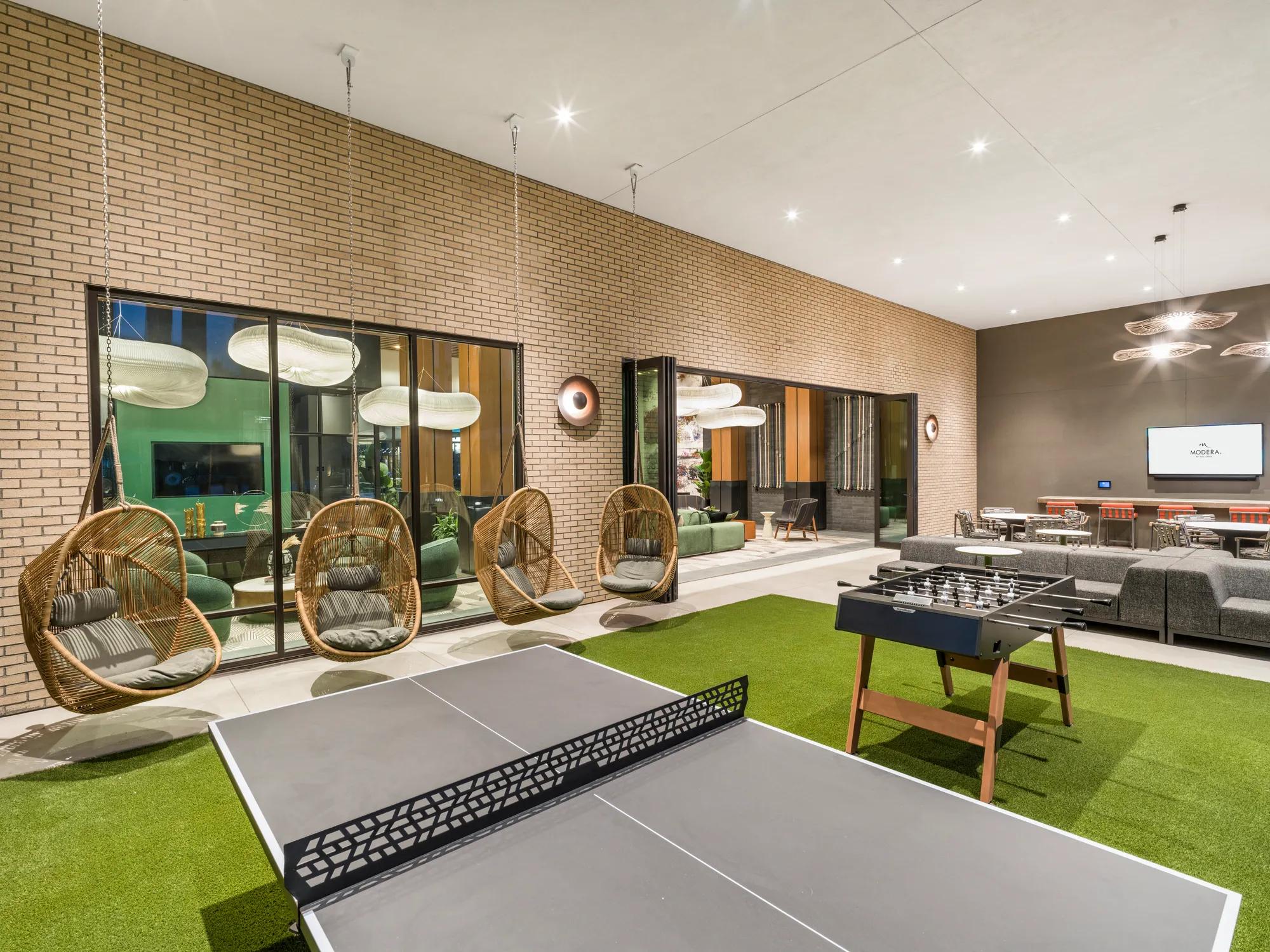 ping pong and foosball tables with seating at modera scottsdale apartment homes for rent in scottsdale az