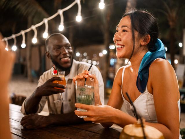 man and woman having drinks outside at night modera mcgavock apartment homes for rent in nashville tn