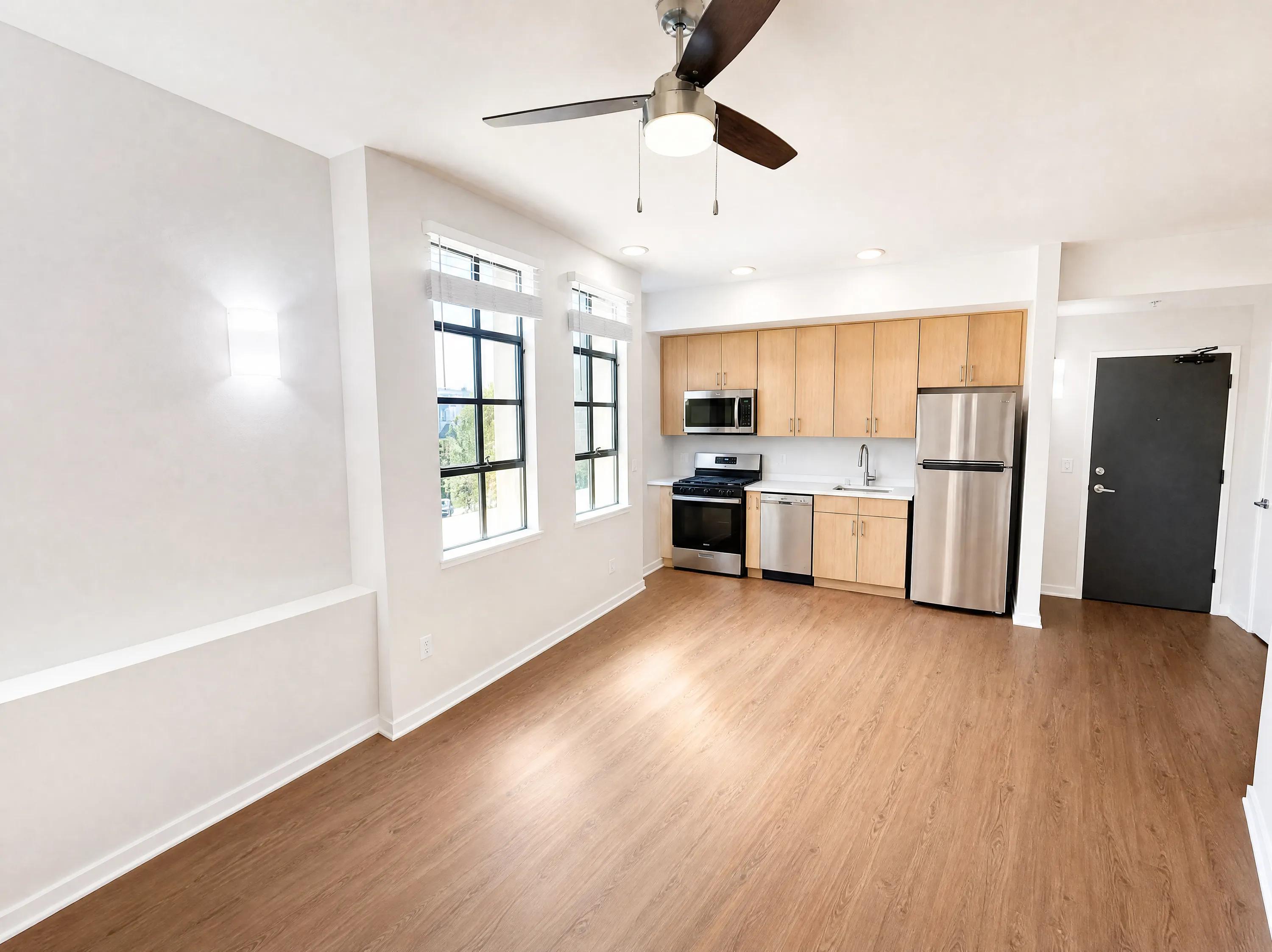 Newly redesigned kitchen featuring with stainless steel appliances, and sleek countertops bachenheimer apartments