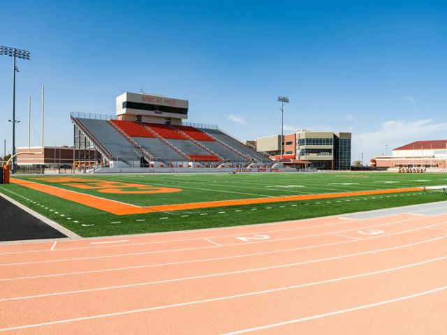 football on turf field in stadium amavi celina single family homes for rent in texas
