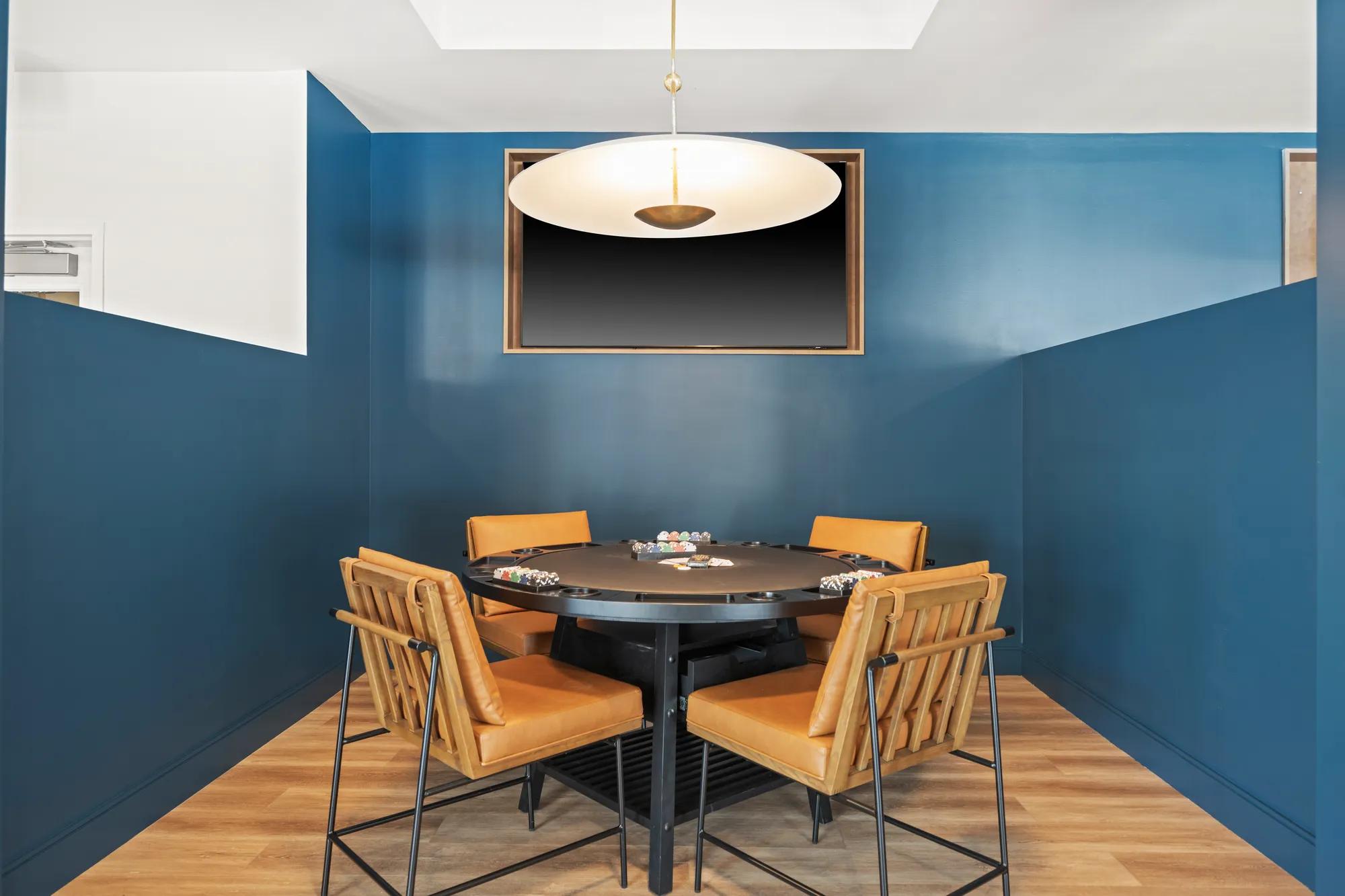 gaming room poker table with tv at modera newton apartment homes for rent in ma