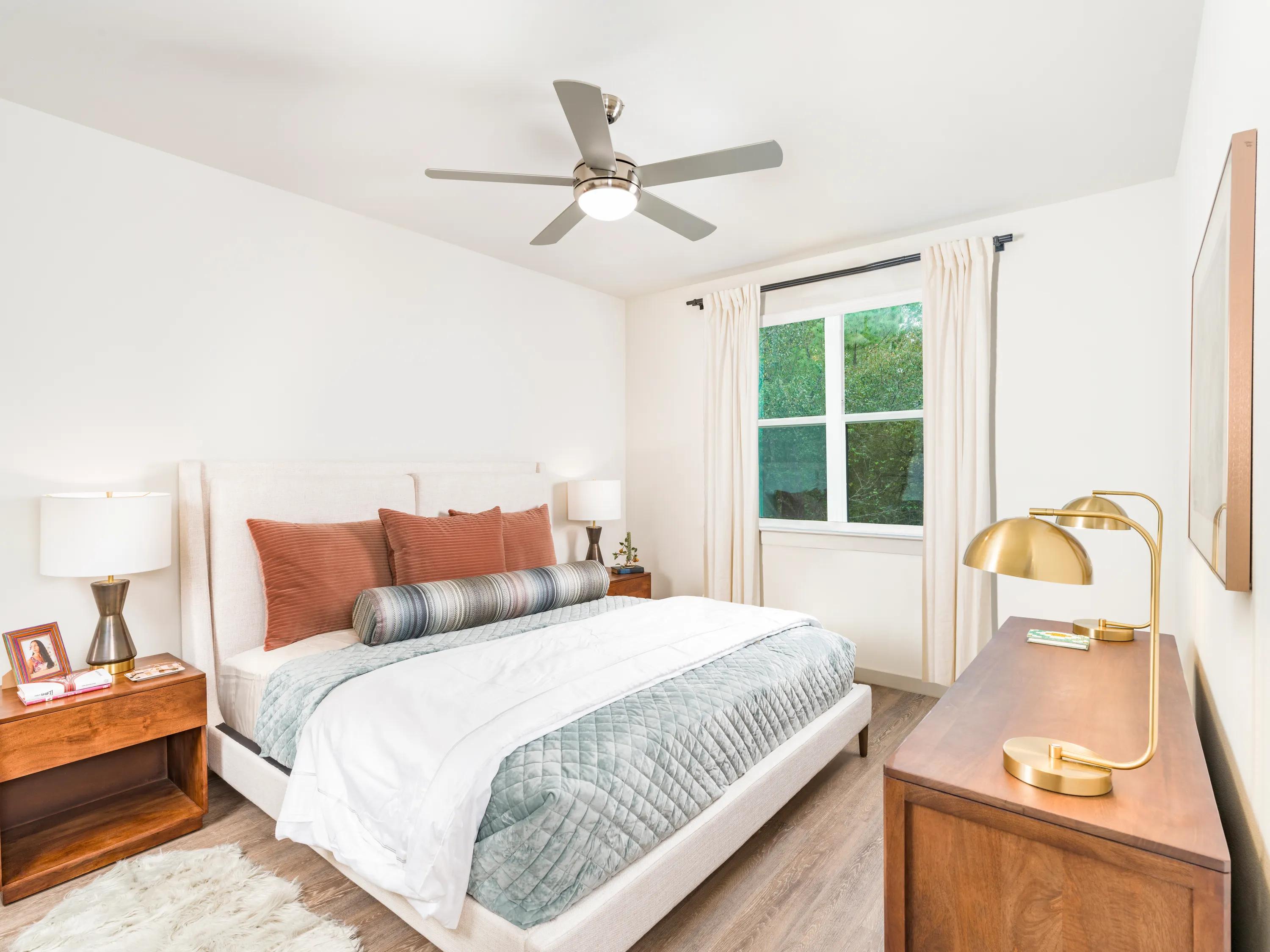 bedroom with large window and natural lighting beckett west fork apartment homes for rent in conroe tx