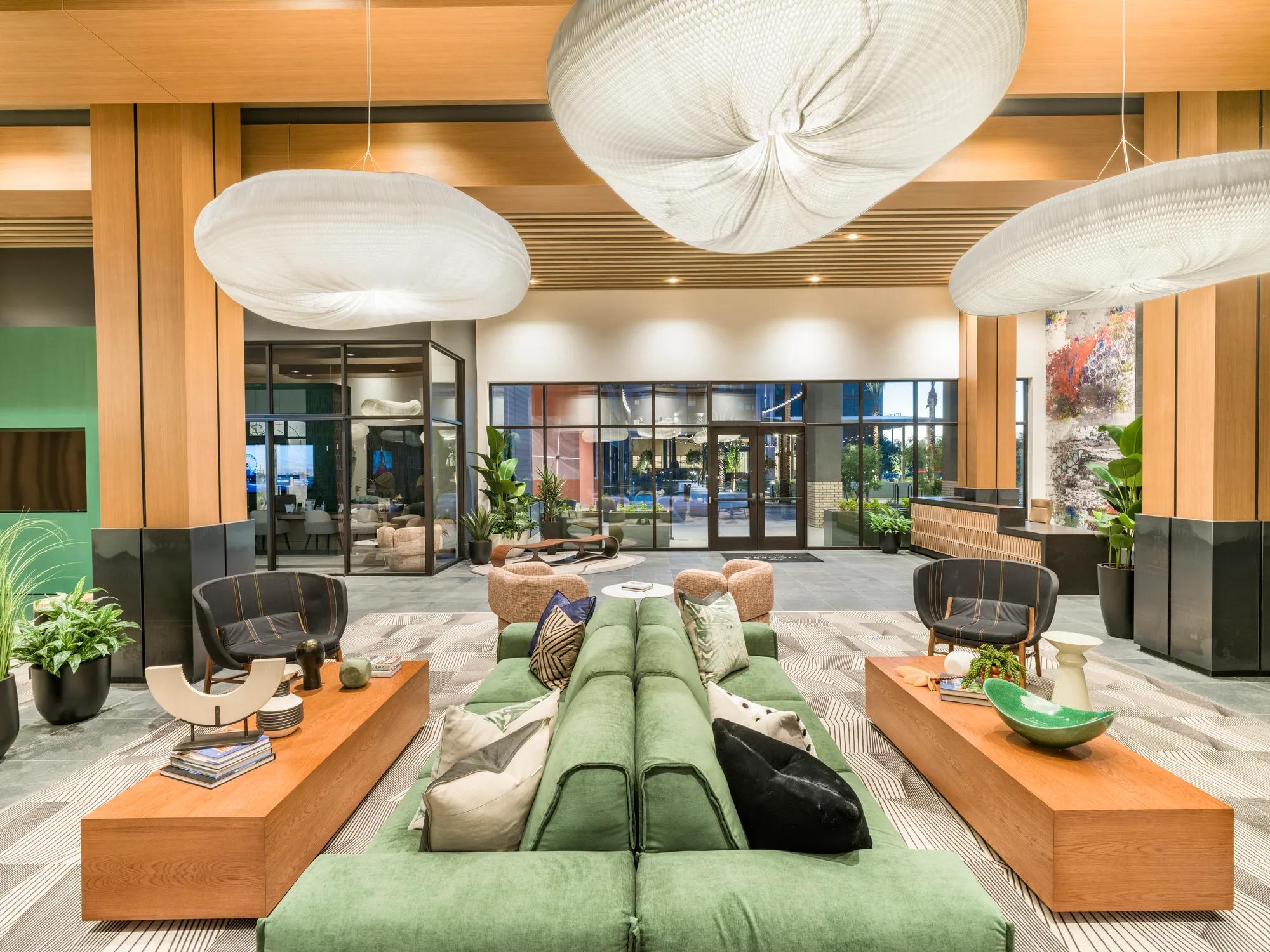 lobby clubroom with modern fireplace and seating modera scottsdale apartment homes for rent in az