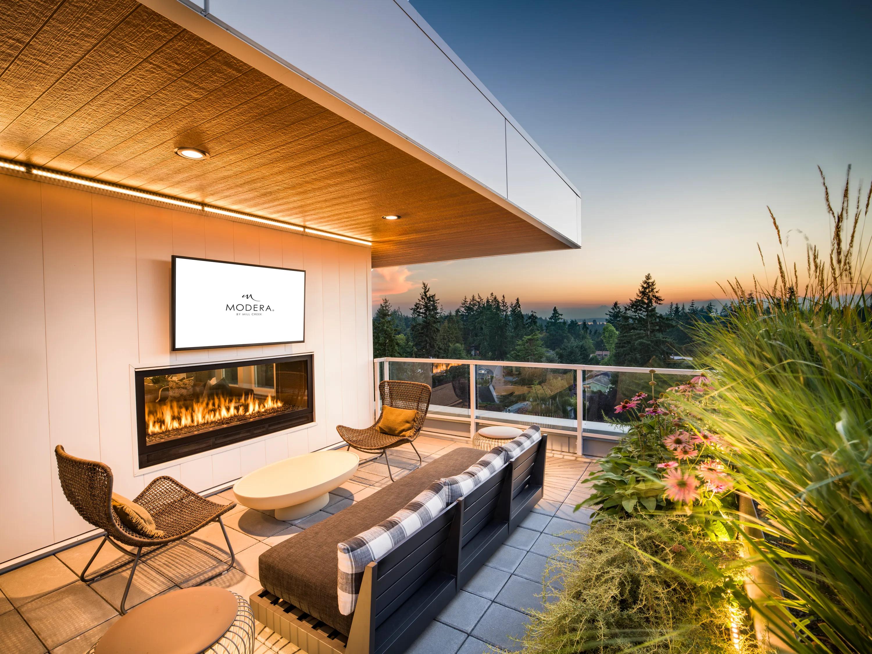 Two outdoor terraces with lounge seating and sweeping views of Puget Sound