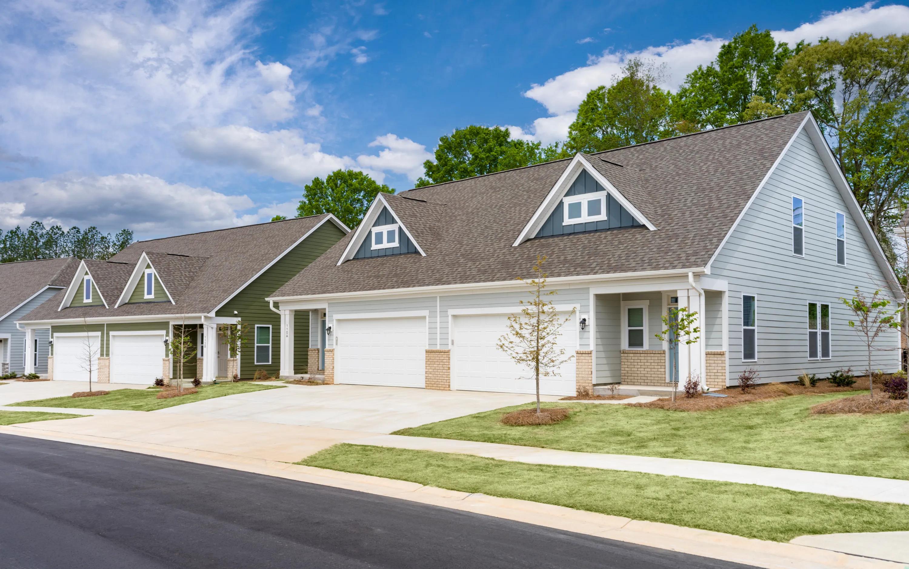 partly cloud day in neighbhoord with home and garage with sidewalk amavi mooresville apartment homes for rent in nc