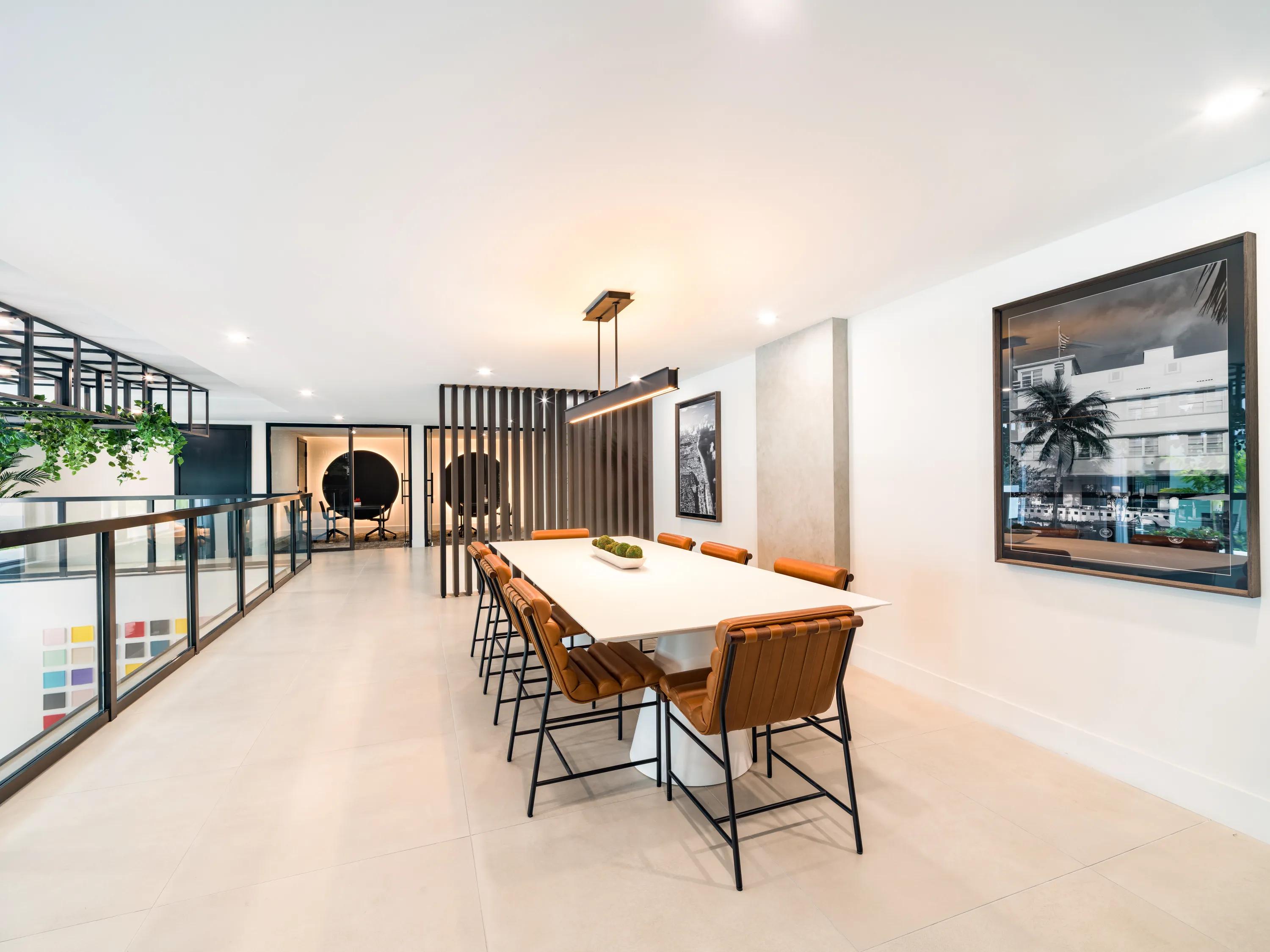 Communal dining table with seating for larger gatherings modera coral springs phase 2 apartments in coral springs fl