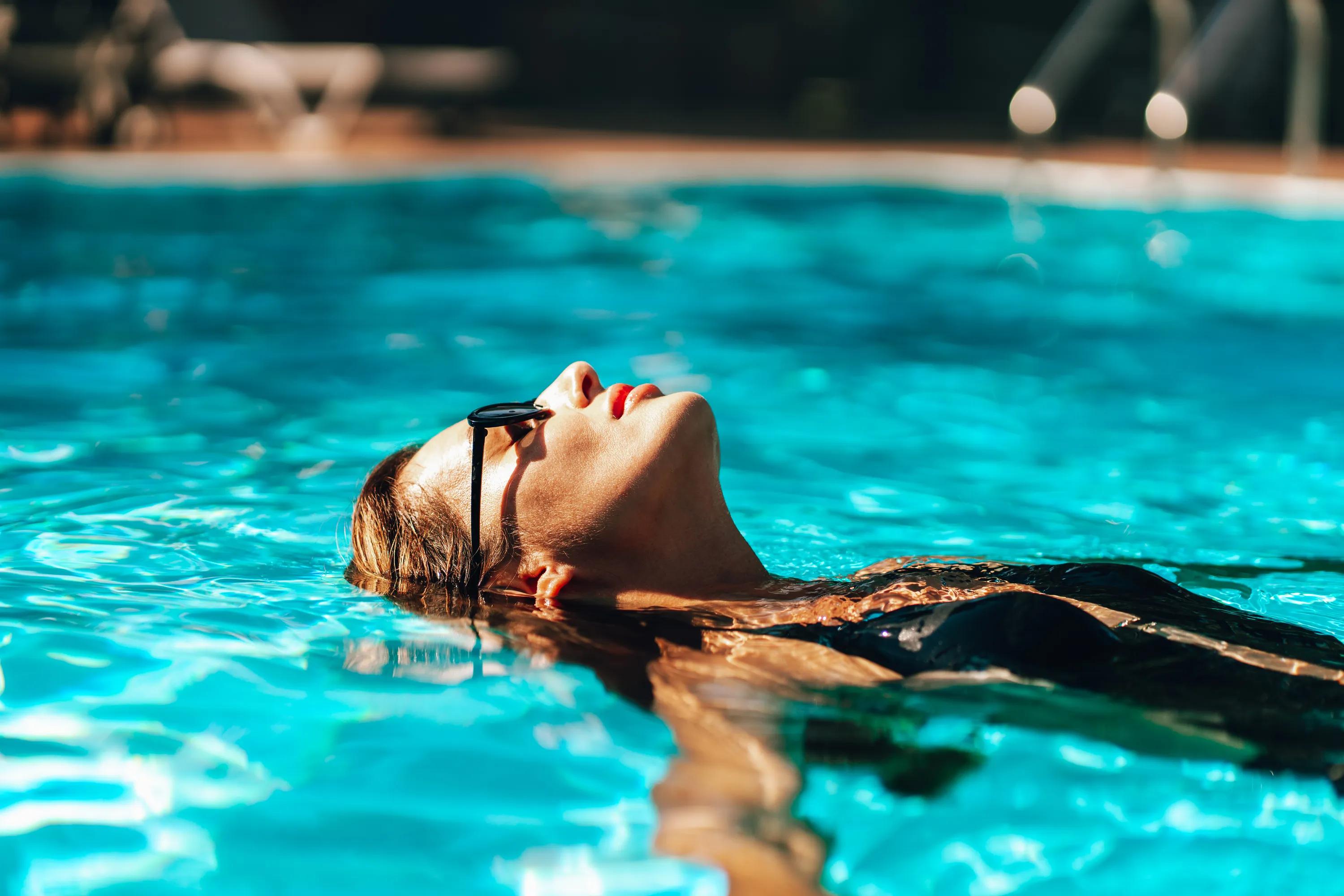 Resort-style pool and spa with spacious sundeck and cabanas modera second avenue denver apartments co