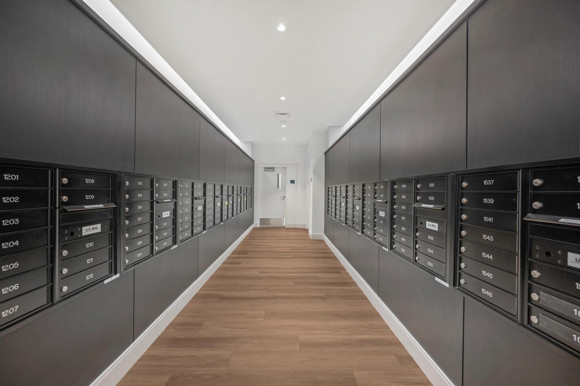 mail room with black walls and po boxes at modera newton apartment homes for rent in ma