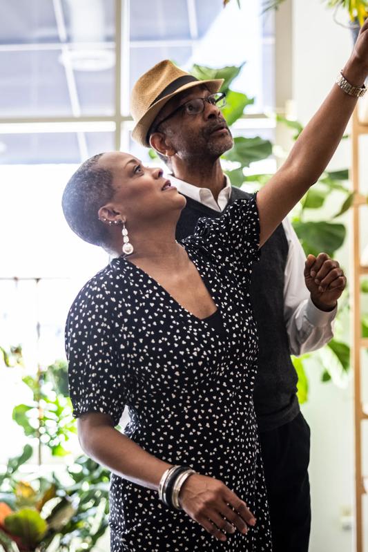 mature couple at a plant shop pointing and smiling modera reynoldstown apartments in atlanta ga