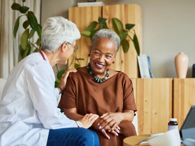 mature woman sitting while speaking to doctor modera aventura miami fl