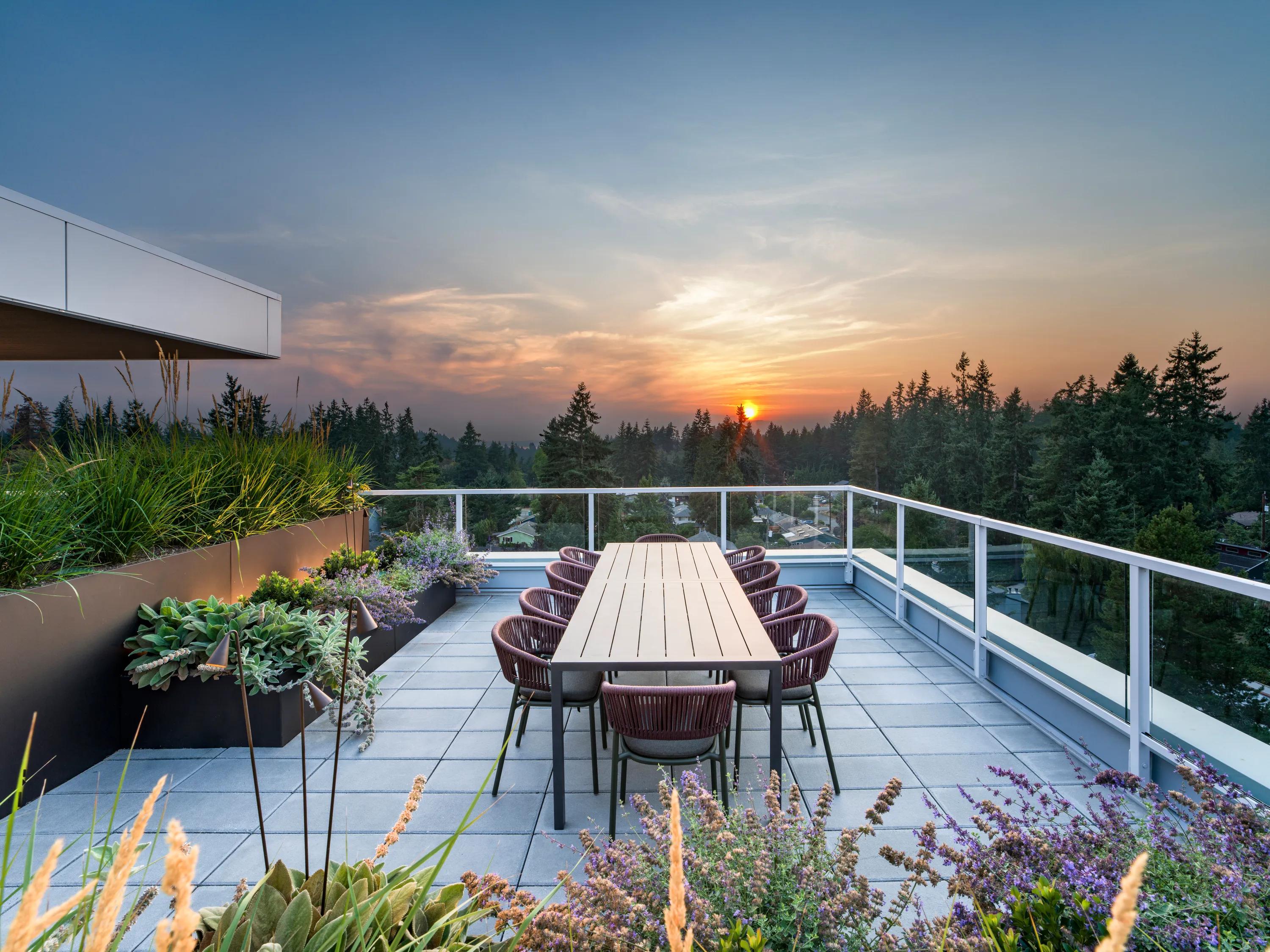 skyline view from rooftop lounge at sunset modera shoreline apartment homes for rent in wa