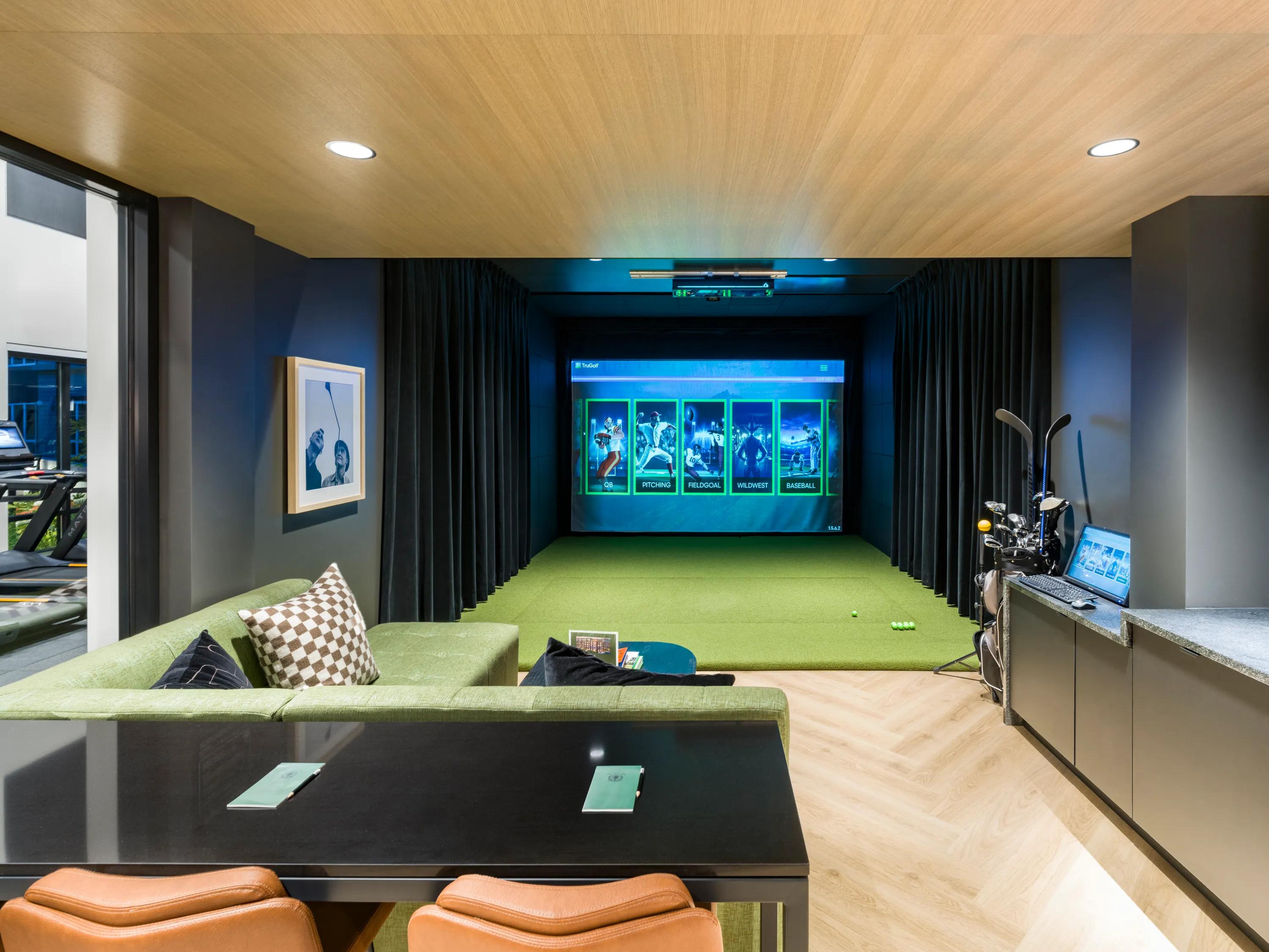 Multi-sport simulator lounge with comfortable seating modera beaverton apartments in beaverton or