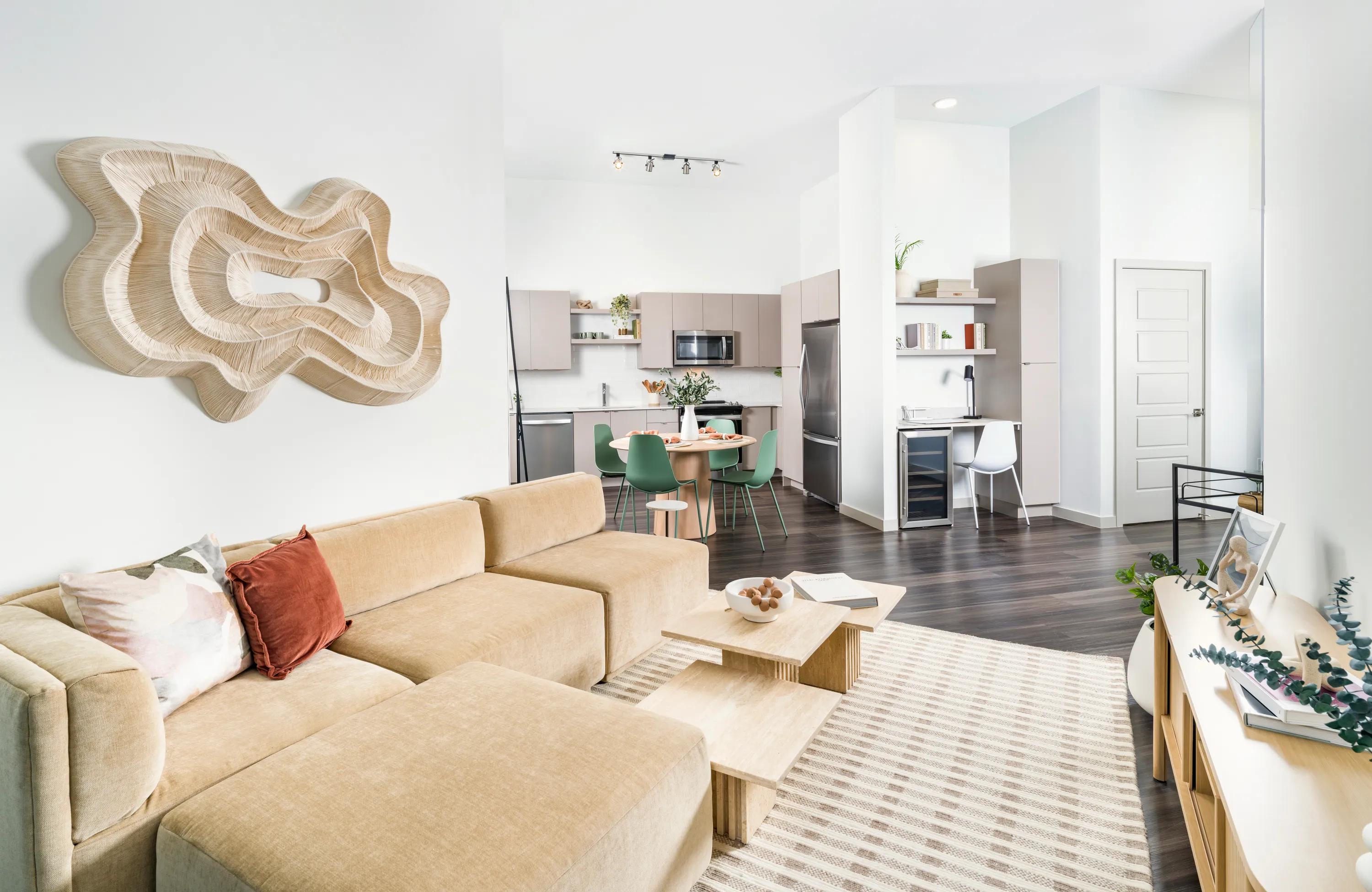 spacious living rooms with hardwood style flooring  modera academical village apartment homes for rent in davie fl