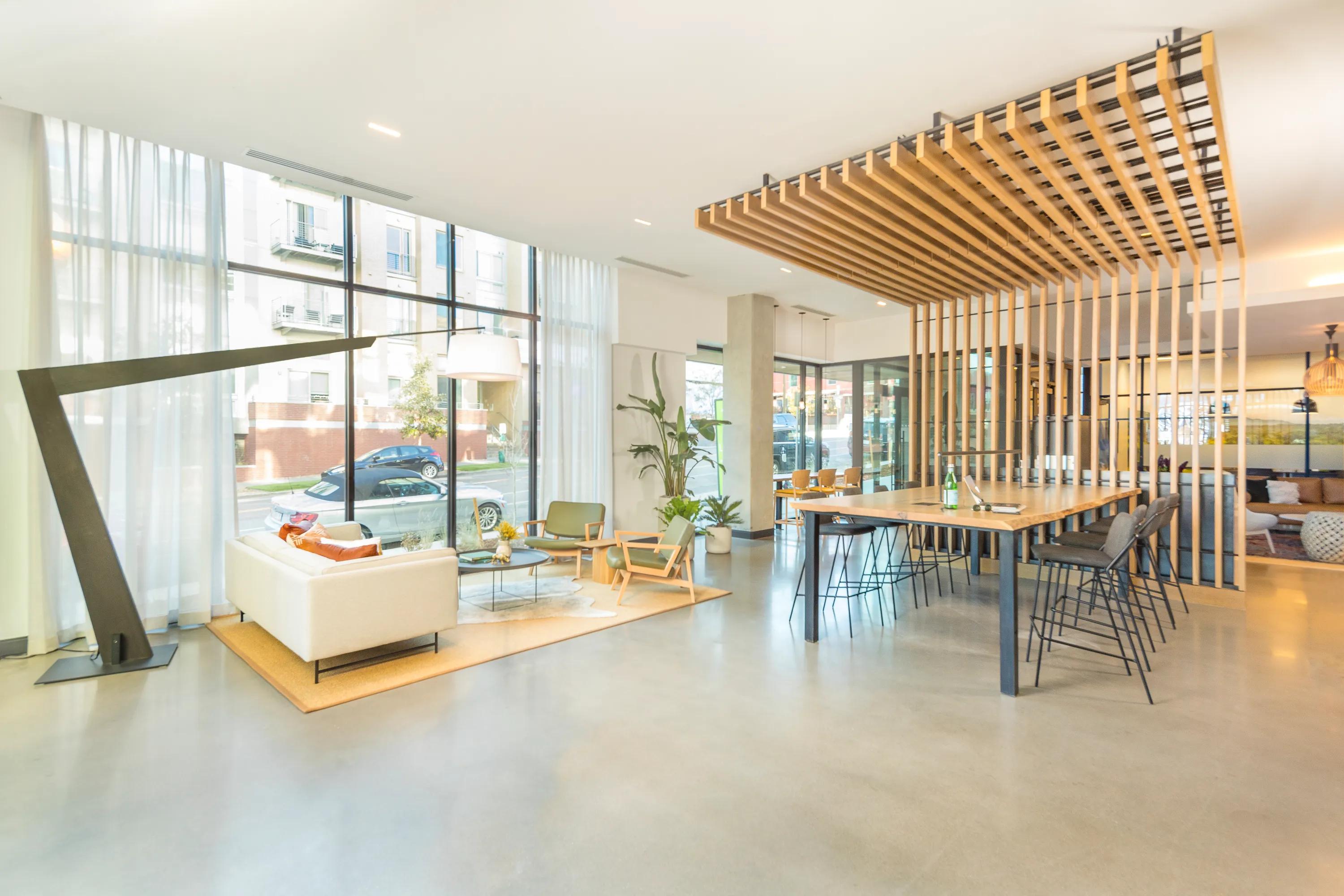 Lounge with work from home conference table and complimentary WiFi modera lohi apartments in denver co