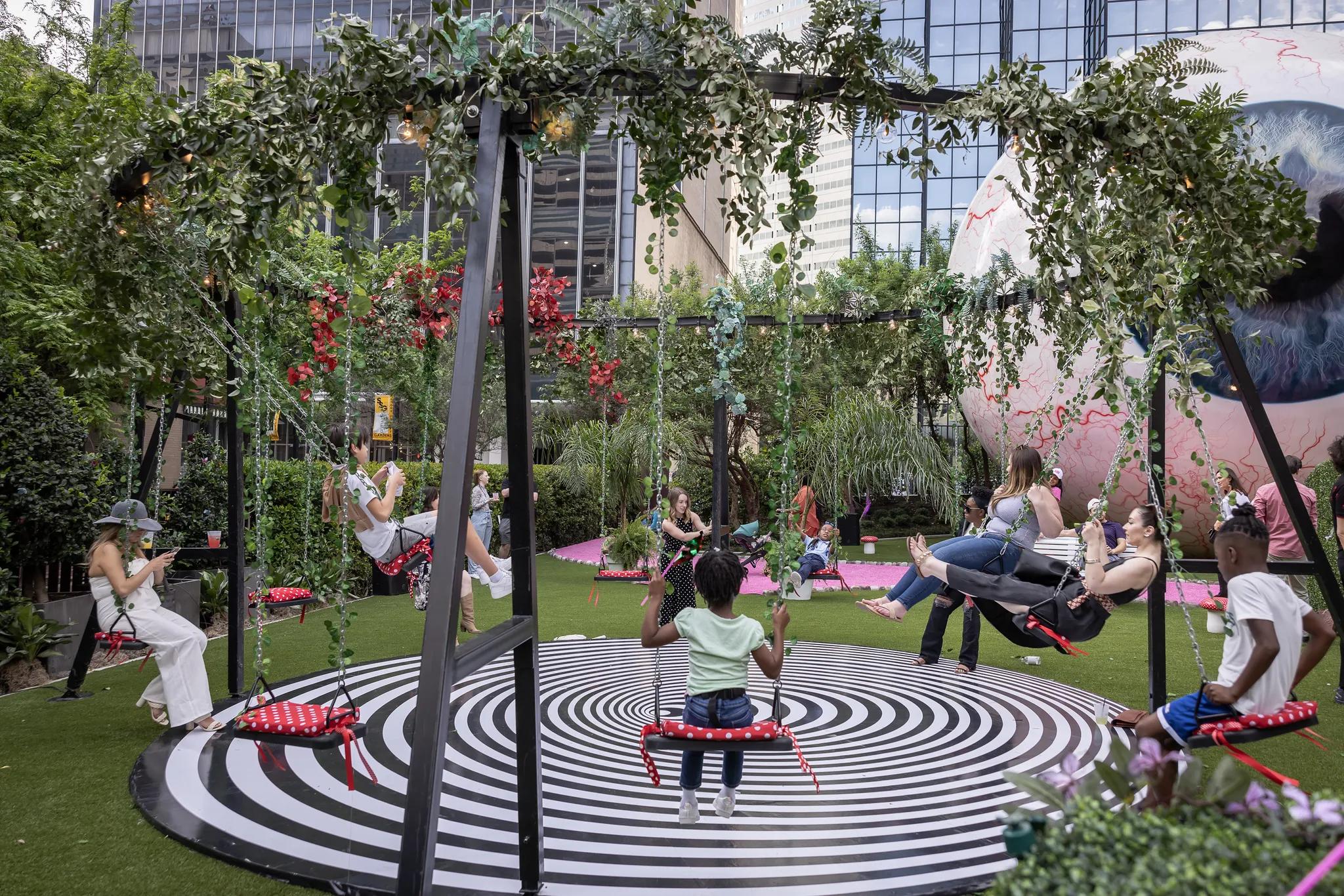 interesting art park with circular swings modera st paul dallas art district apartments tx