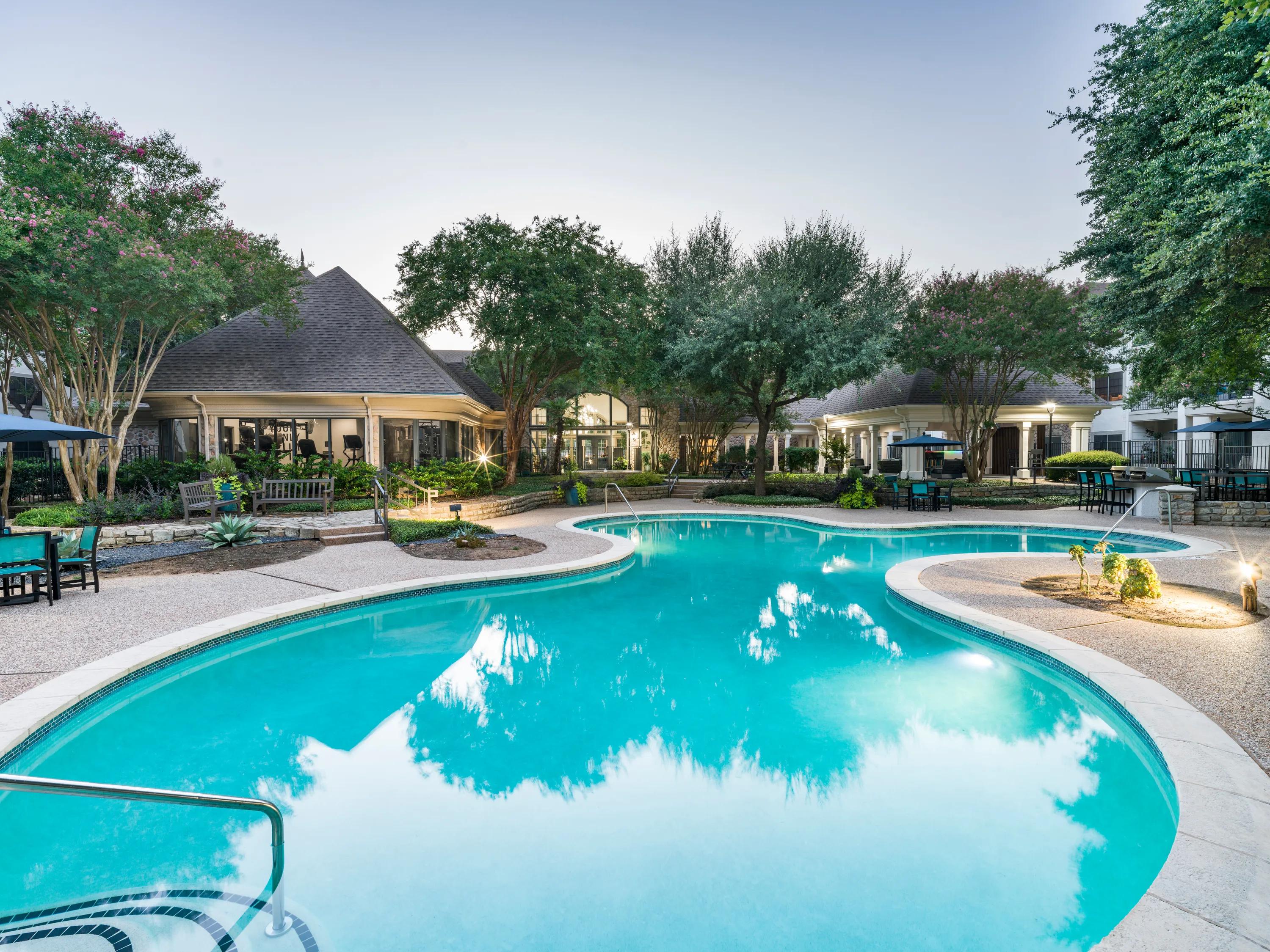 pool with lush landscaping alister sunset valley apartment homes for rent in austin tx