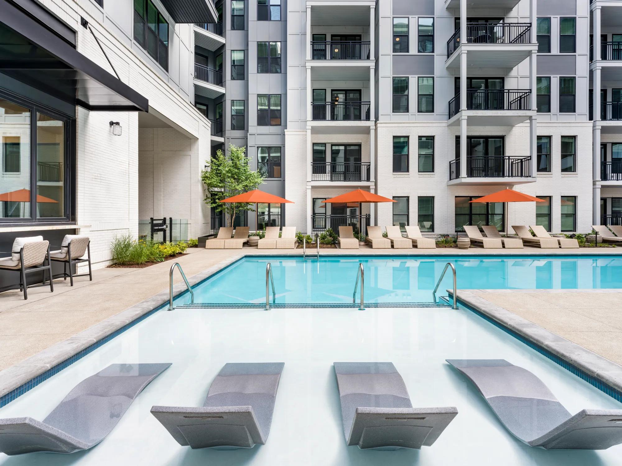 swiming pool with large sundeck modera riverview apartment homes for rent in tn rendering