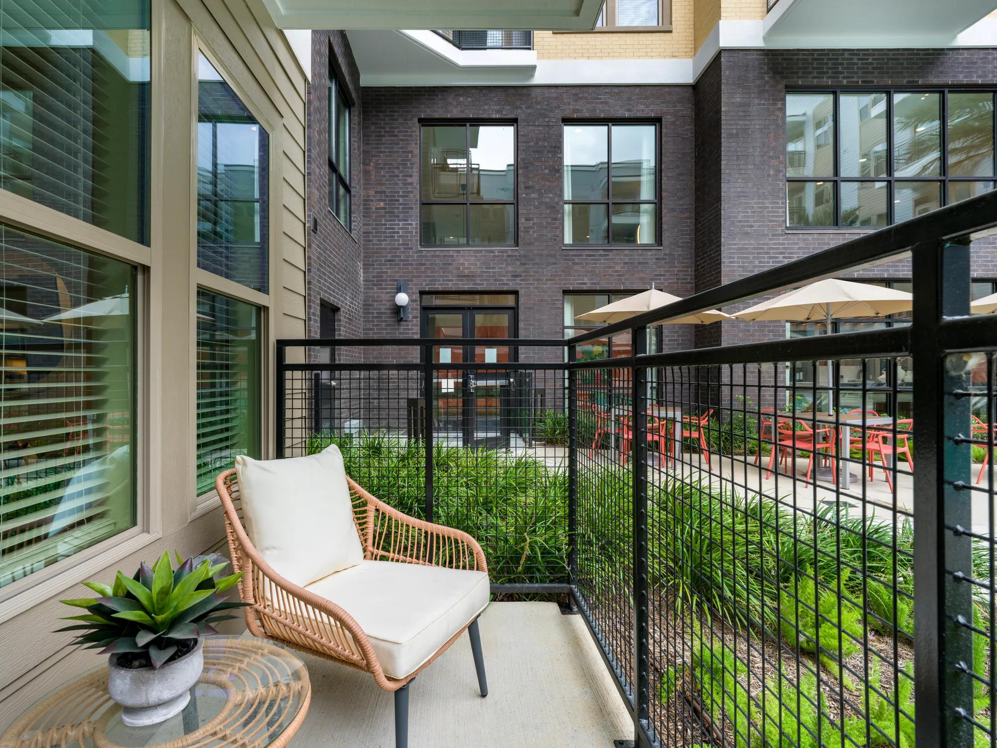 Outdoor patios with views of community courtyard and pool