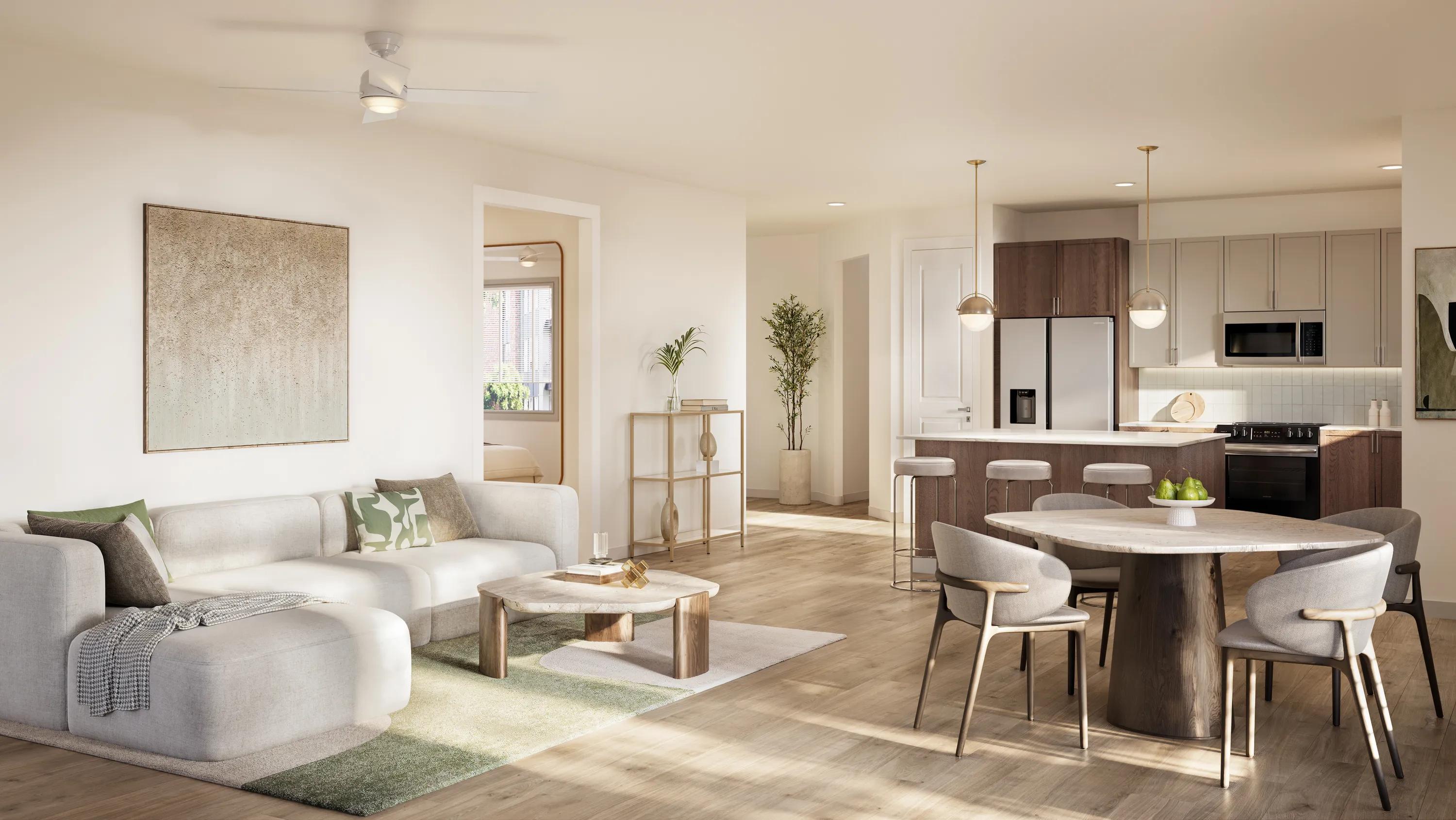 Open-concept apartment home with wood-style flooring, a spacious living area, a large kitchen island with bar seating, contemporary cabinetry, stainless steel appliances, and designer pendant lighting at Modera Ridgeline apartments in McKinney, TX.
