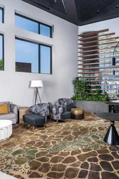 clubroom with large windows and fireplace with seating modera h street apartment homes for rent in washington dc