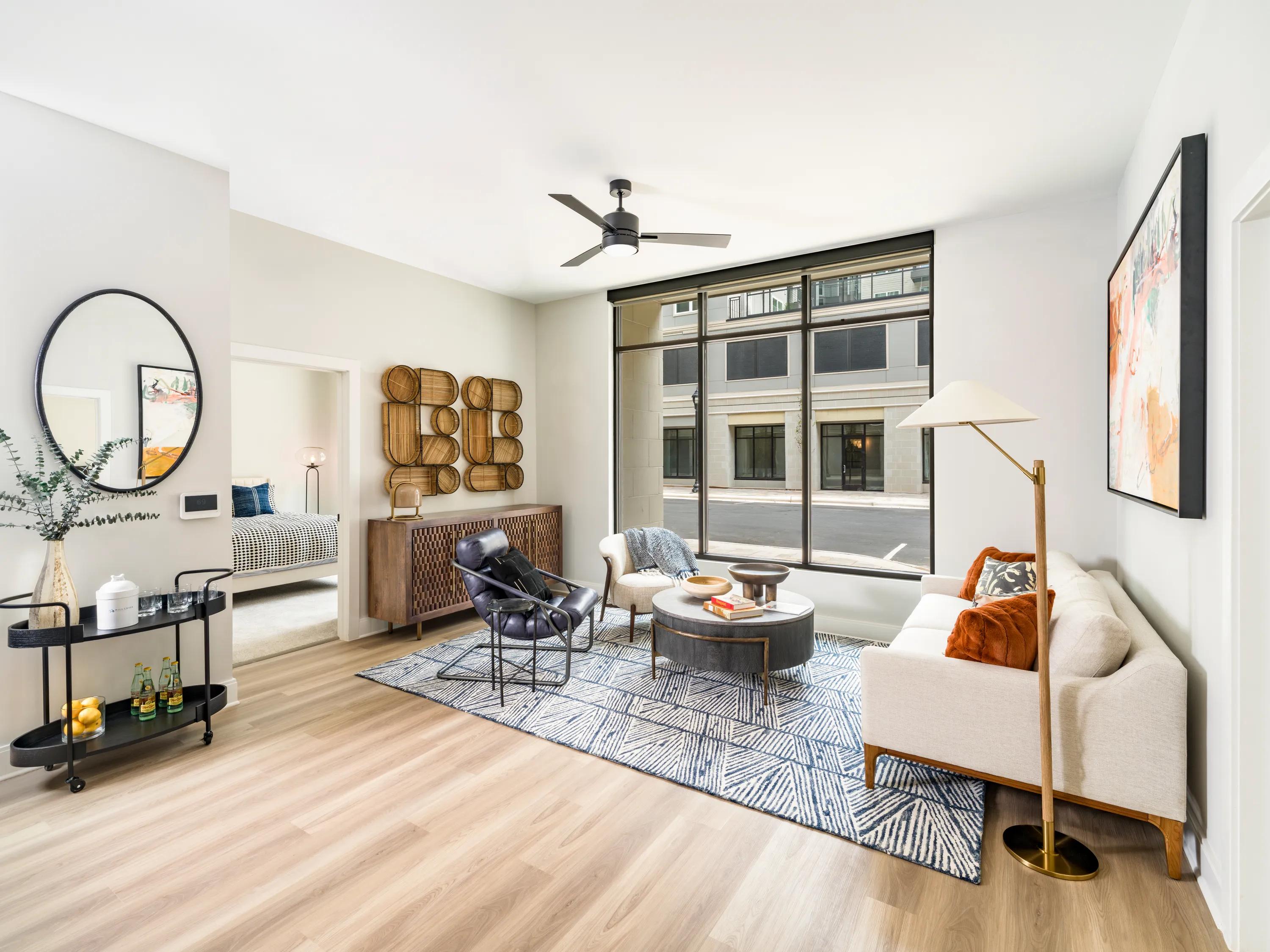 living room with large window and balcony modera liberty row apartment homes for rent in in charlotte nc