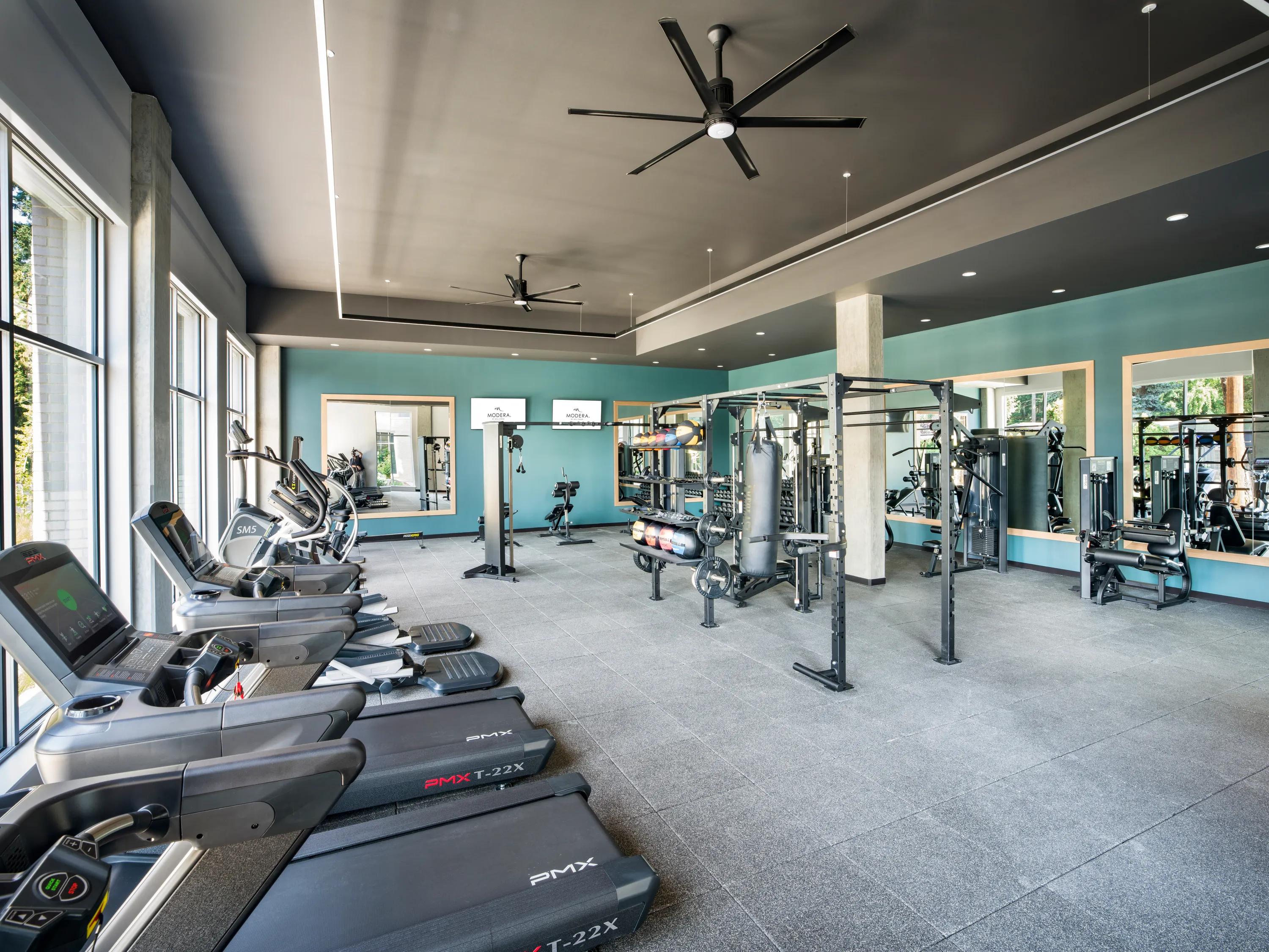gym with large windows and aerobic equipment modera shoreline apartment homes for rent in wa