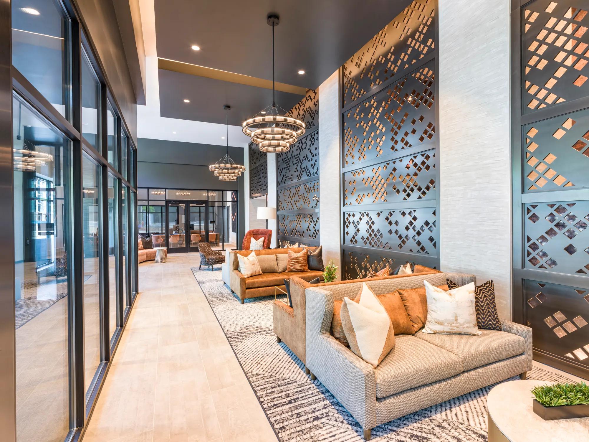 coffee station in lobby with high ceilings and seating modera loso apartment homes for rent in charlotte nc